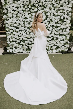 Bride Wearing Simple Sheath Satin Dress With Back Bow Mitchell By Maggie Sottero