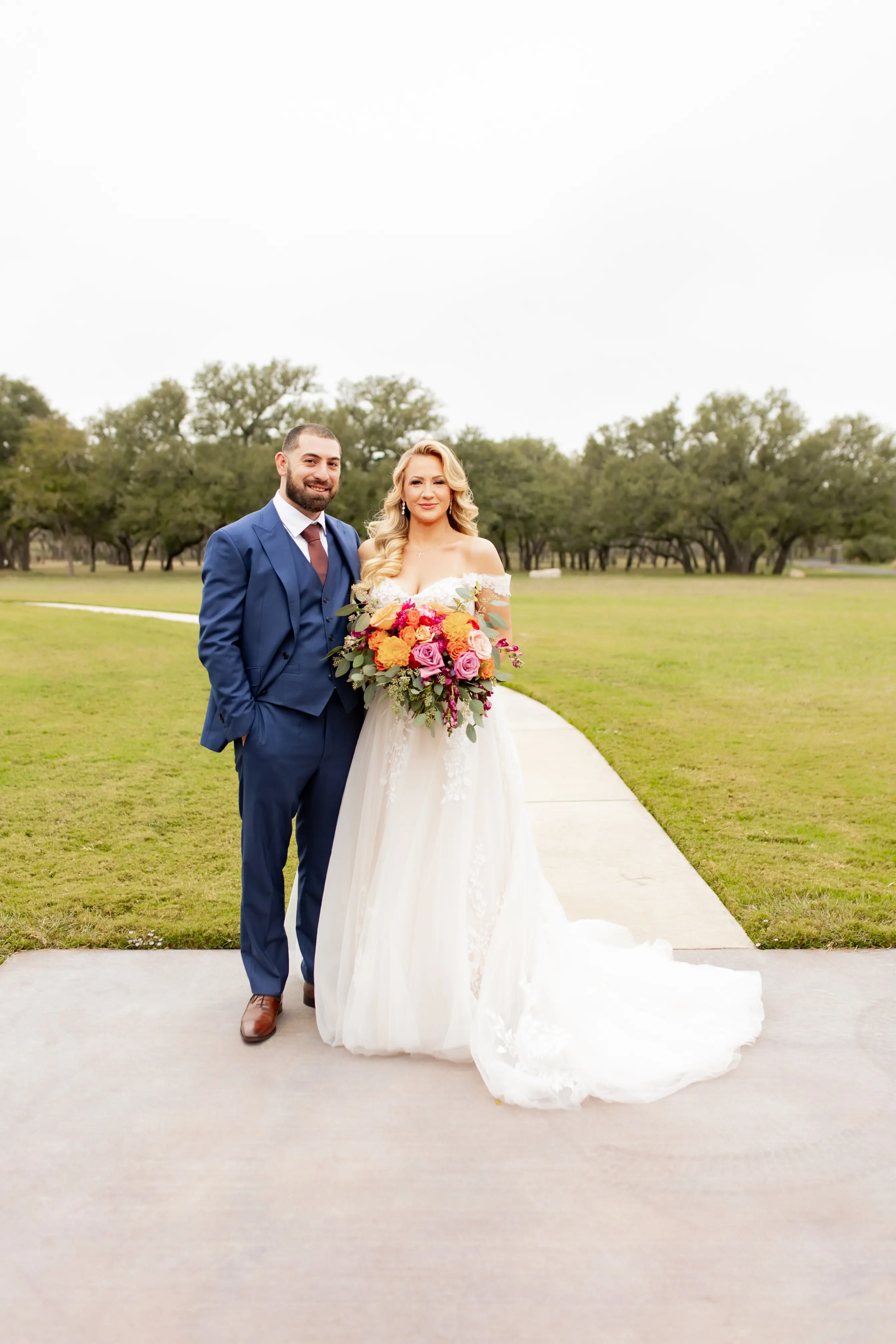 Bride wearing Harlem by Maggie Sottero with her husband