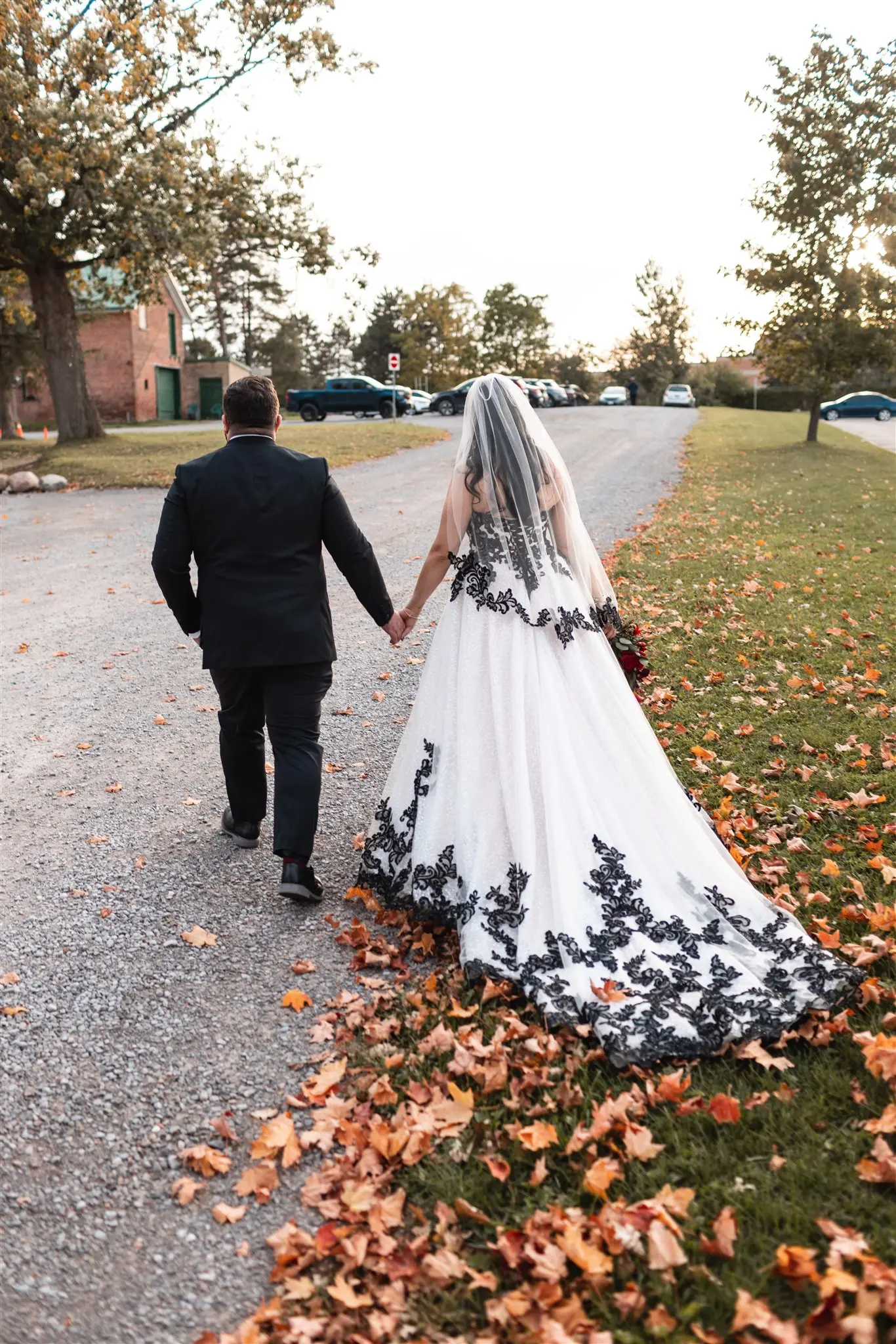 Bride In Strapless Black Wedding Dress Called Tristyn By Maggie Sottero With Groom