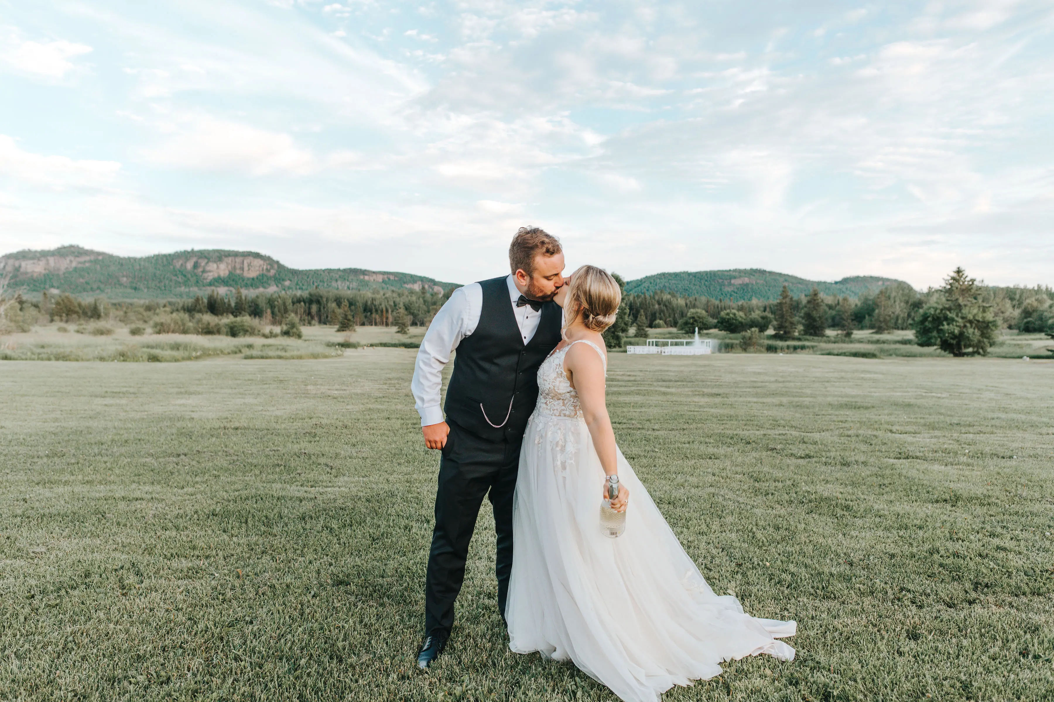 Groom With Bride Wearing V-Neck A-Line Wedding Dress Minerva By Rebecca Ingram