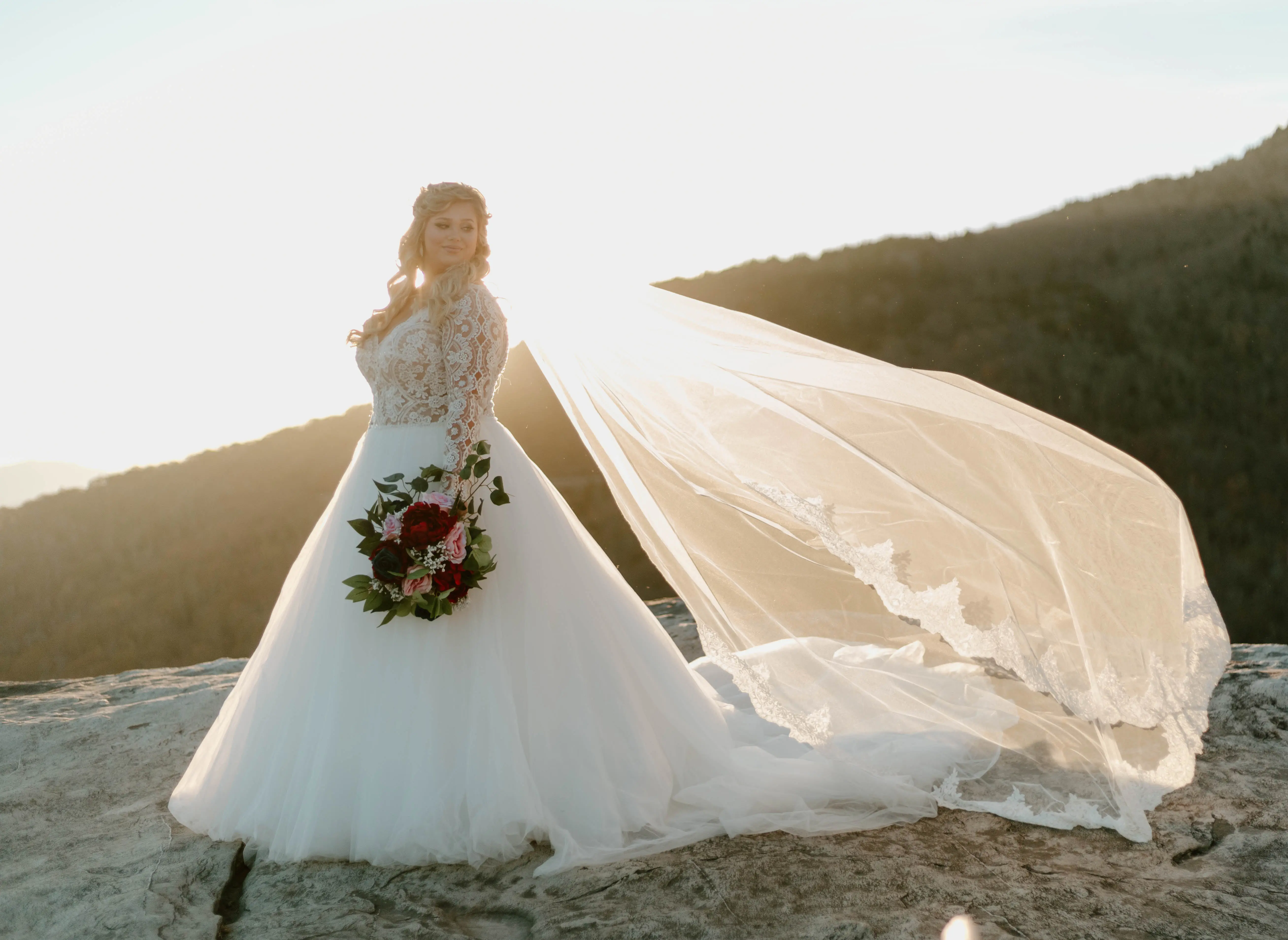 Bride In Long Sleeve Lace Ball Gown Wedding Dress Named Mallory Dawn By Maggie Sottero And Long Veil