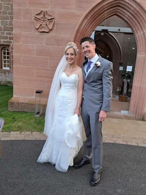 Bride wearing Helen by Rebecca Ingram with her husband