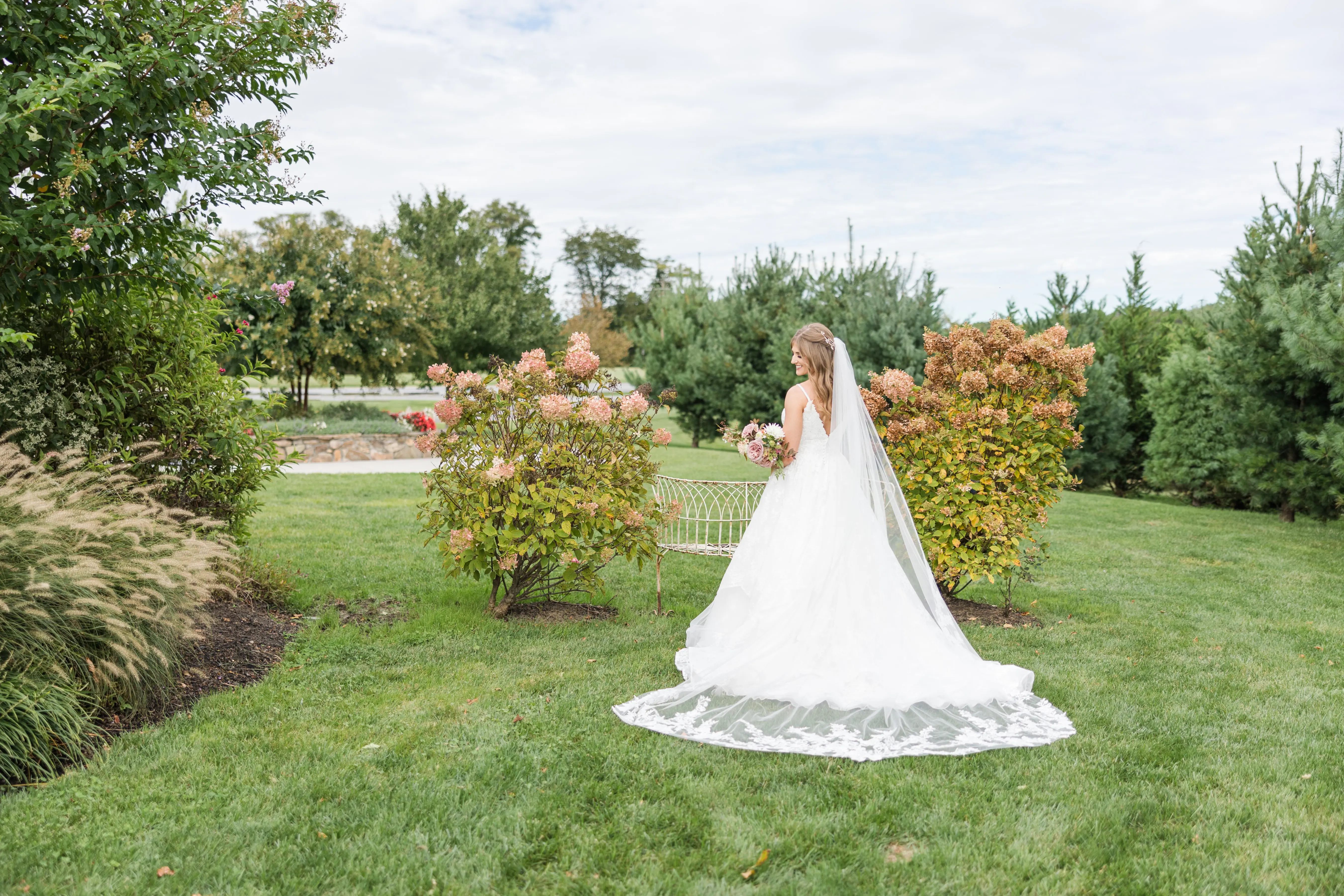 Real Bride in Modern Princess Wedding Dress with a Tiered Sequin Tulle Skirt Called Yuri by Maggie Sottero