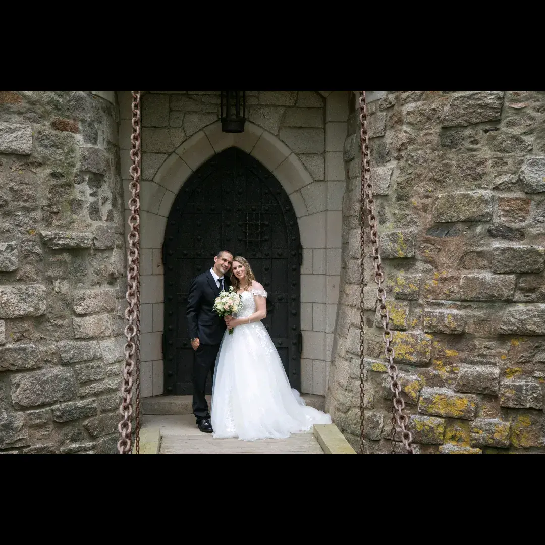 Bride wearing Harlem wedding dress by Maggie Sottero with her husband