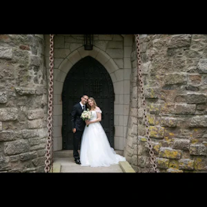 Bride wearing Harlem wedding dress by Maggie Sottero with her husband