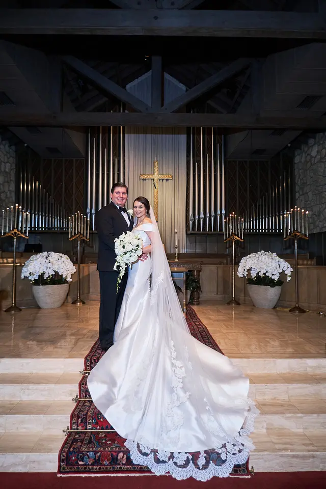 bride with groom in off the shoulder elegant wedding dress