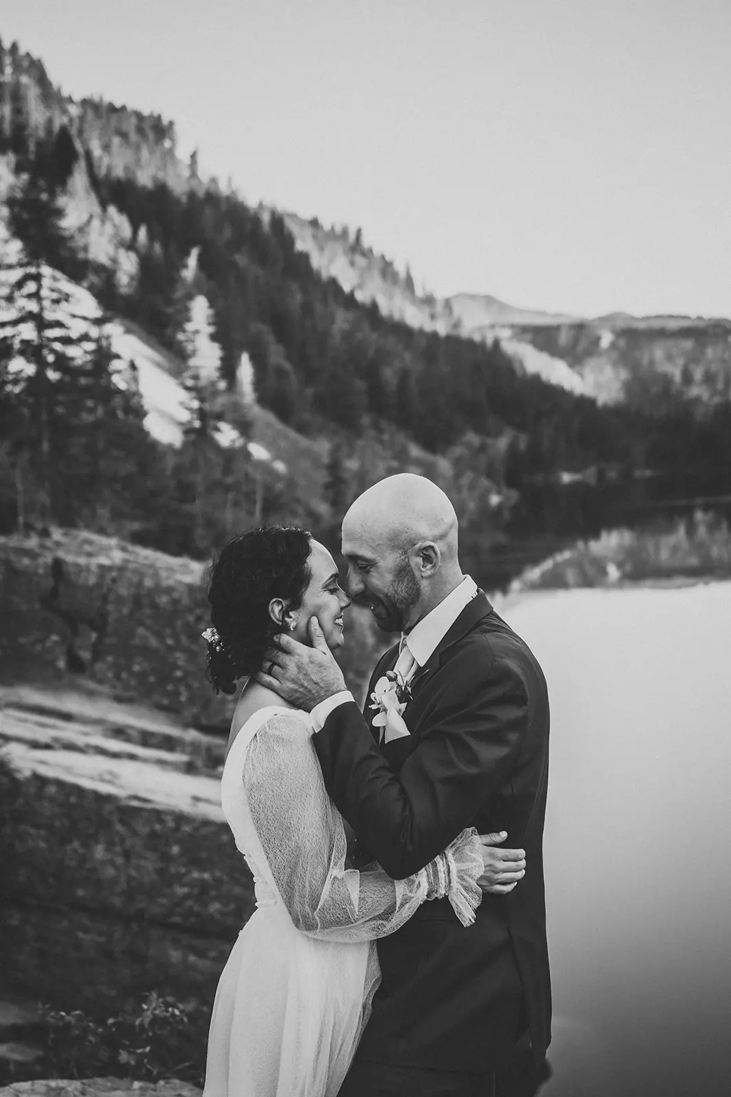 Groom with Bride in Mountains for Outdoors Themed Wedding Wearing Boho Vintage Gown Called Joanne by Rebecca Ingram.