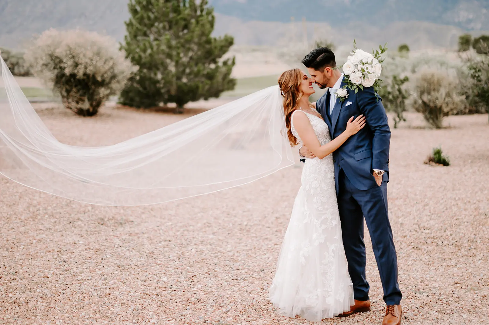 Groom With Bride Wearing Garden Inspired Lace Fit-And-Flare Greenley By Maggie Sottero