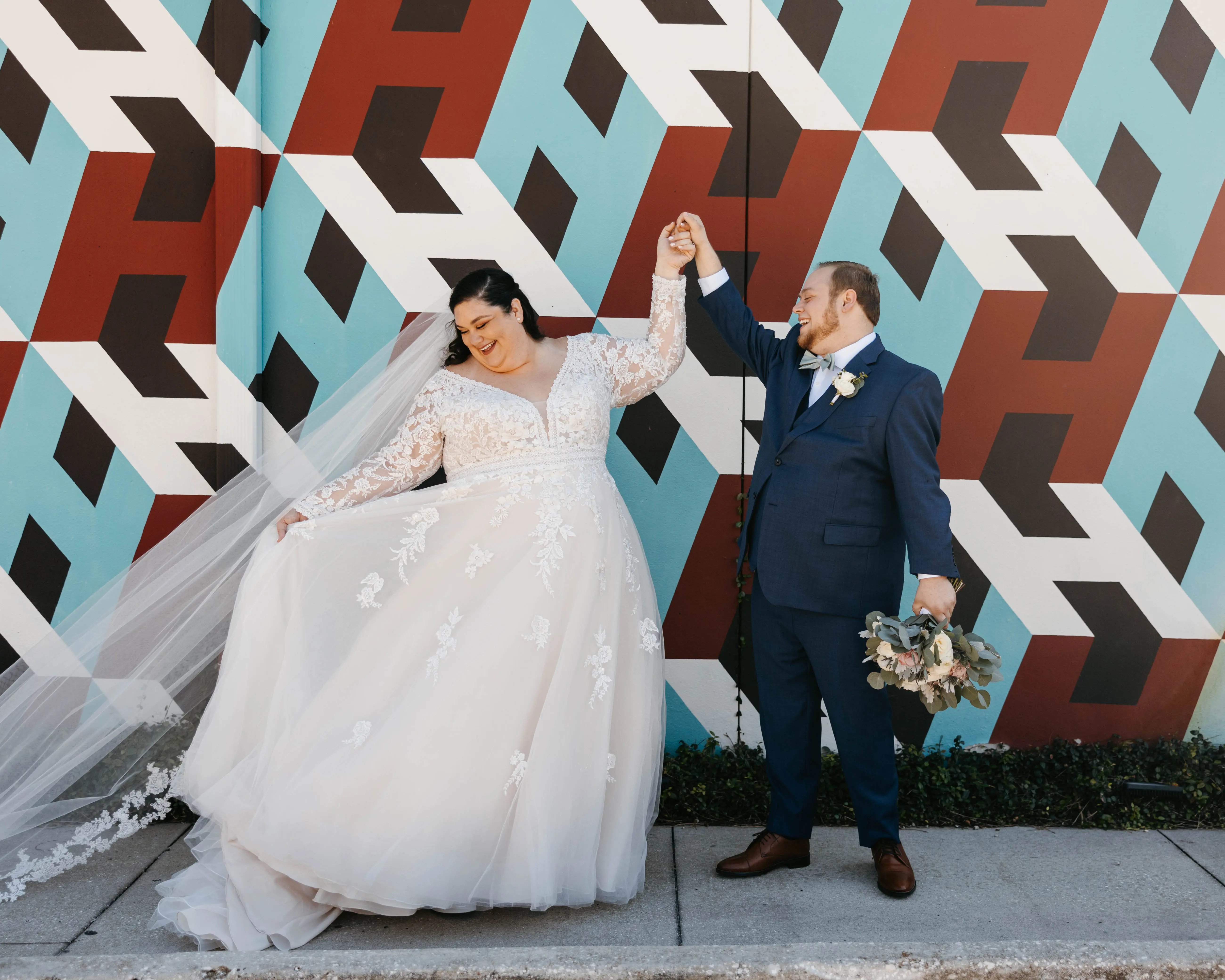 Groom With Bride Wearing Illusion Sleeve A-Line Wedding Dress Raphael By Maggie Sottero