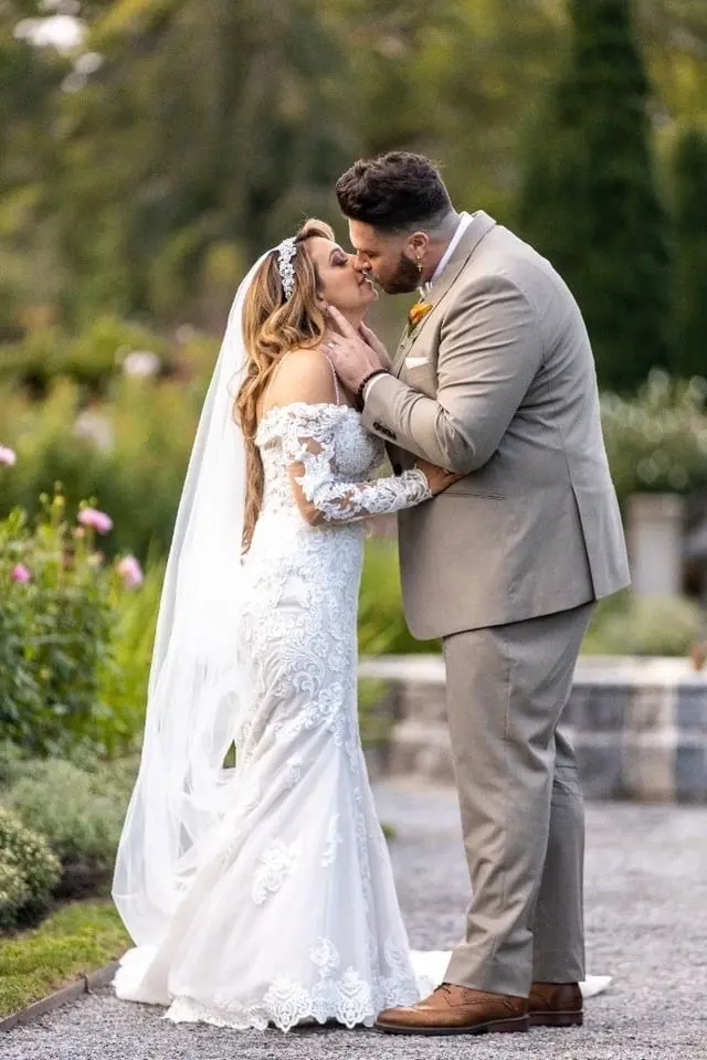 Bride Wearing Sparkly Fit-And-Flare Wedding Dress Called Fiona By Maggie Sottero With Groom