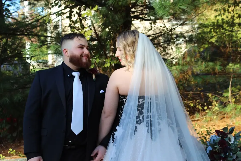 Groom Looking At Bride Bride Wearing Black Lace Wedding Dress Called Tristyn By Maggie Sottero