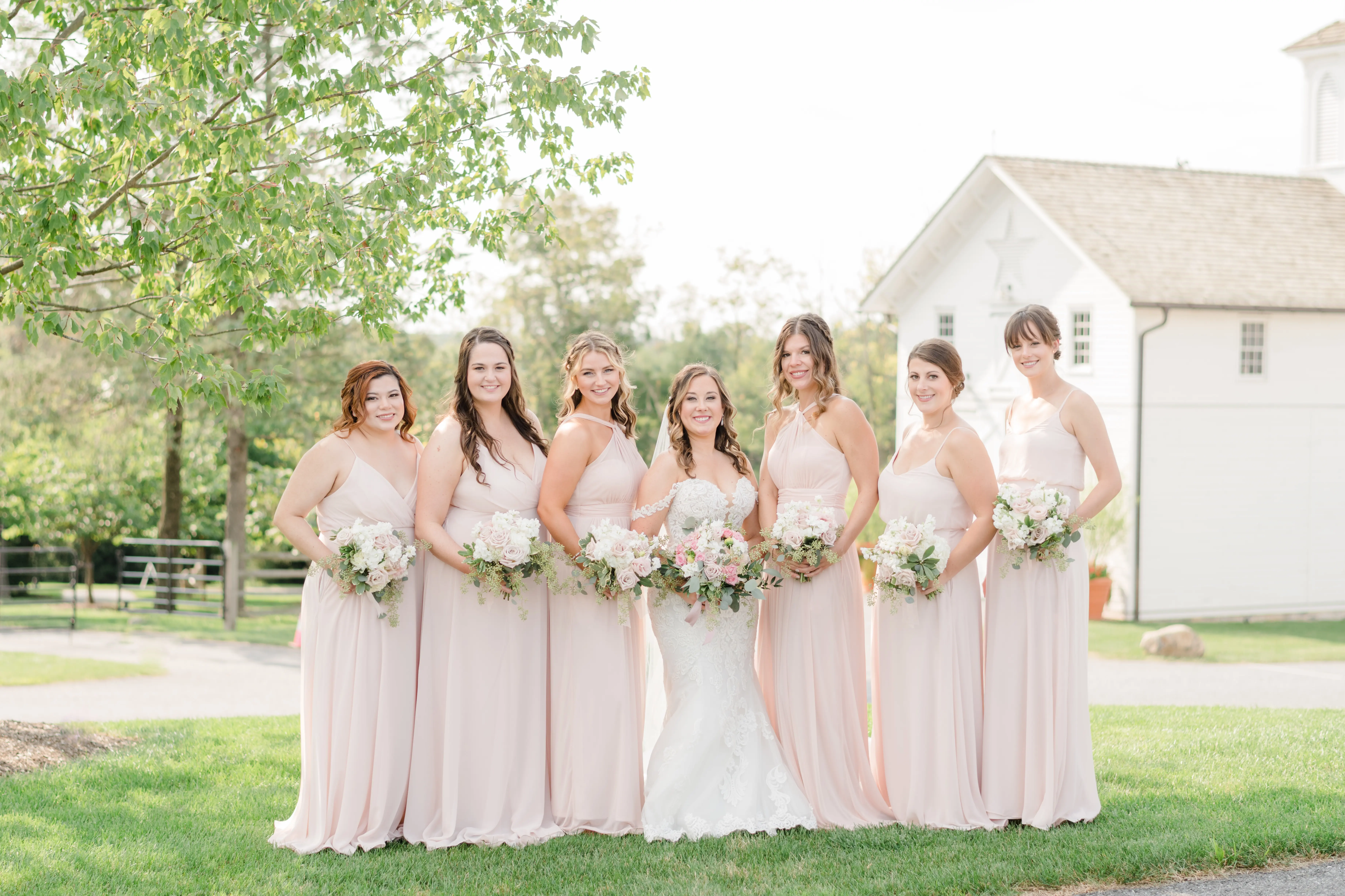 Real bride in sparkly lace fit-and-flare bridal dress with plunging illusion sweetheart neckline called Fiona by Maggie Sottero