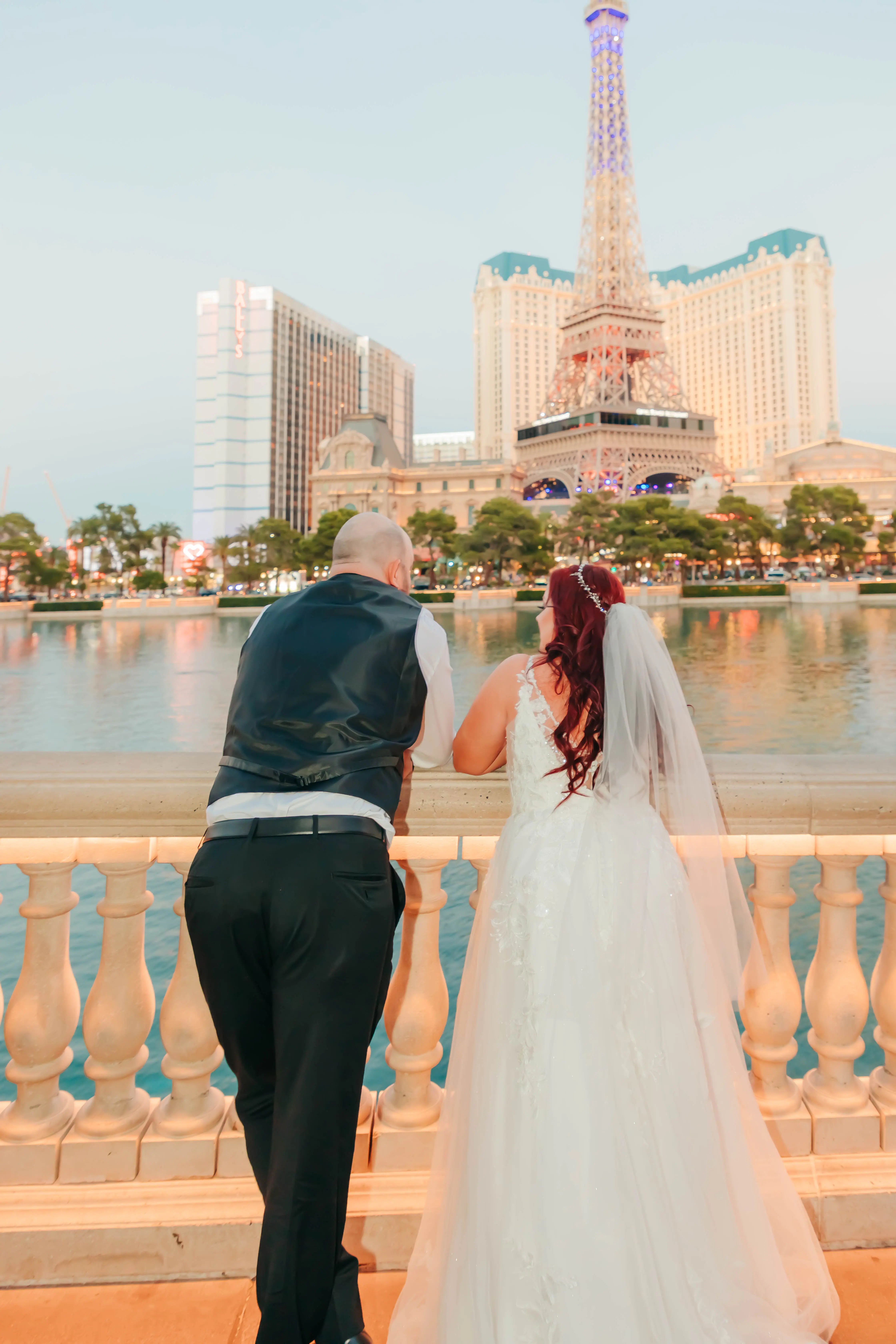 Groom and Bride at a Las Vegas Wedding Wearing Lace Ballgown Called Ellen by Rebecca Ingram