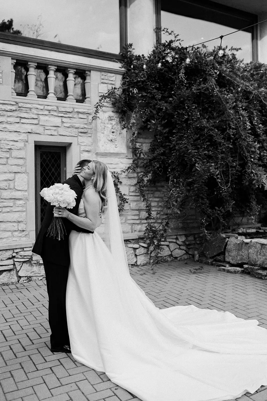 Bride Wearing Simple Aline Wedding Dress Called Aspen By Sottero And Midgley Hugging Groom
