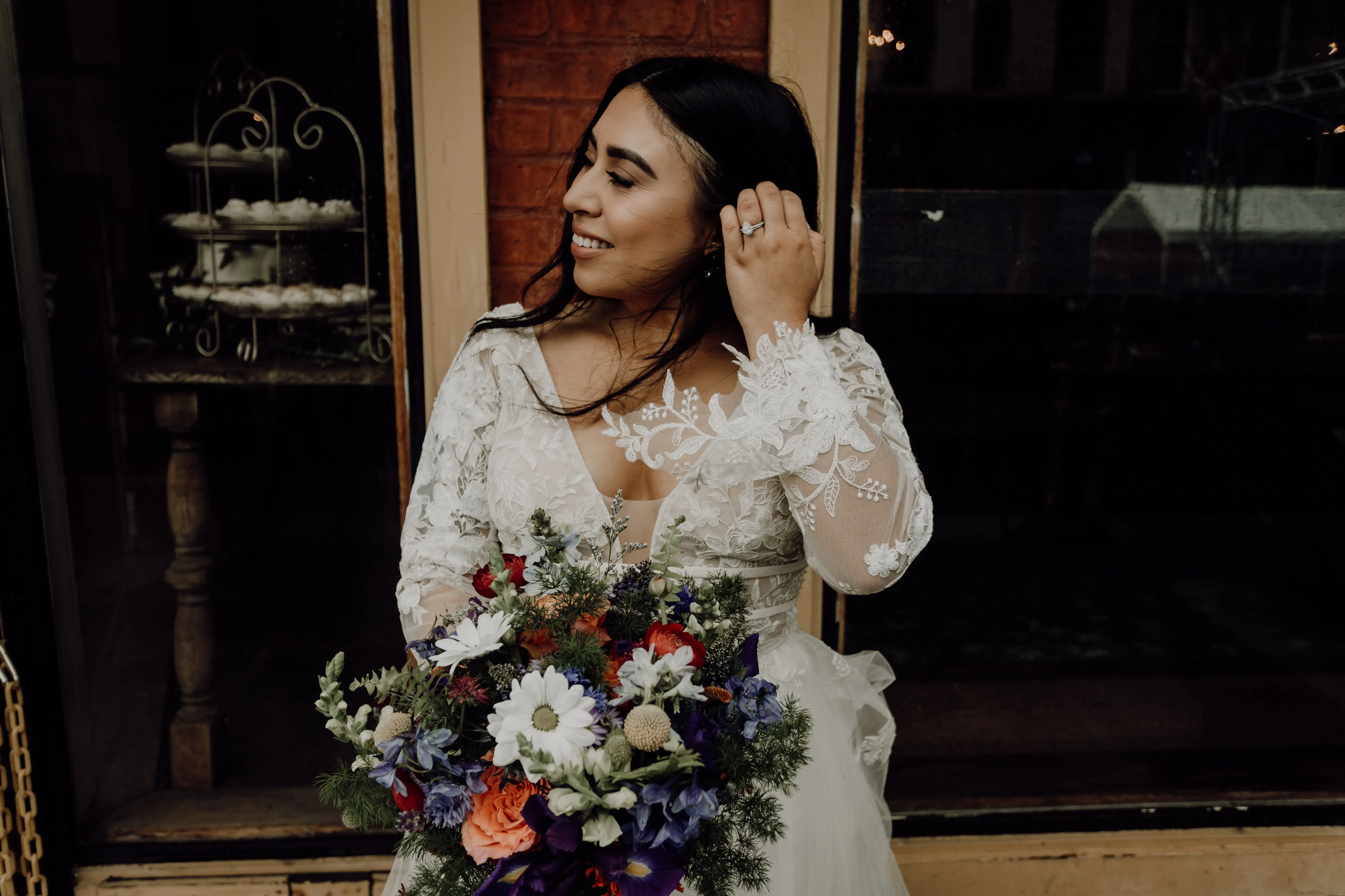 Bride Wearing Lace Aline Wedding Dress Called Raelynn by Rebecca Ingram