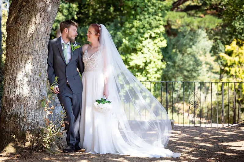 Bride Wearing Affordable Sheath Wedding Dress Called Lorraine By Rebecca Ingram With Groom