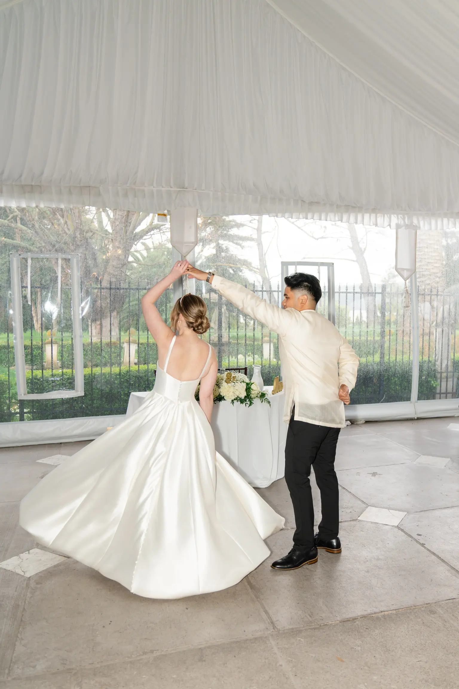 Bride wearing Selena by Maggie Sottero dancing with her husband