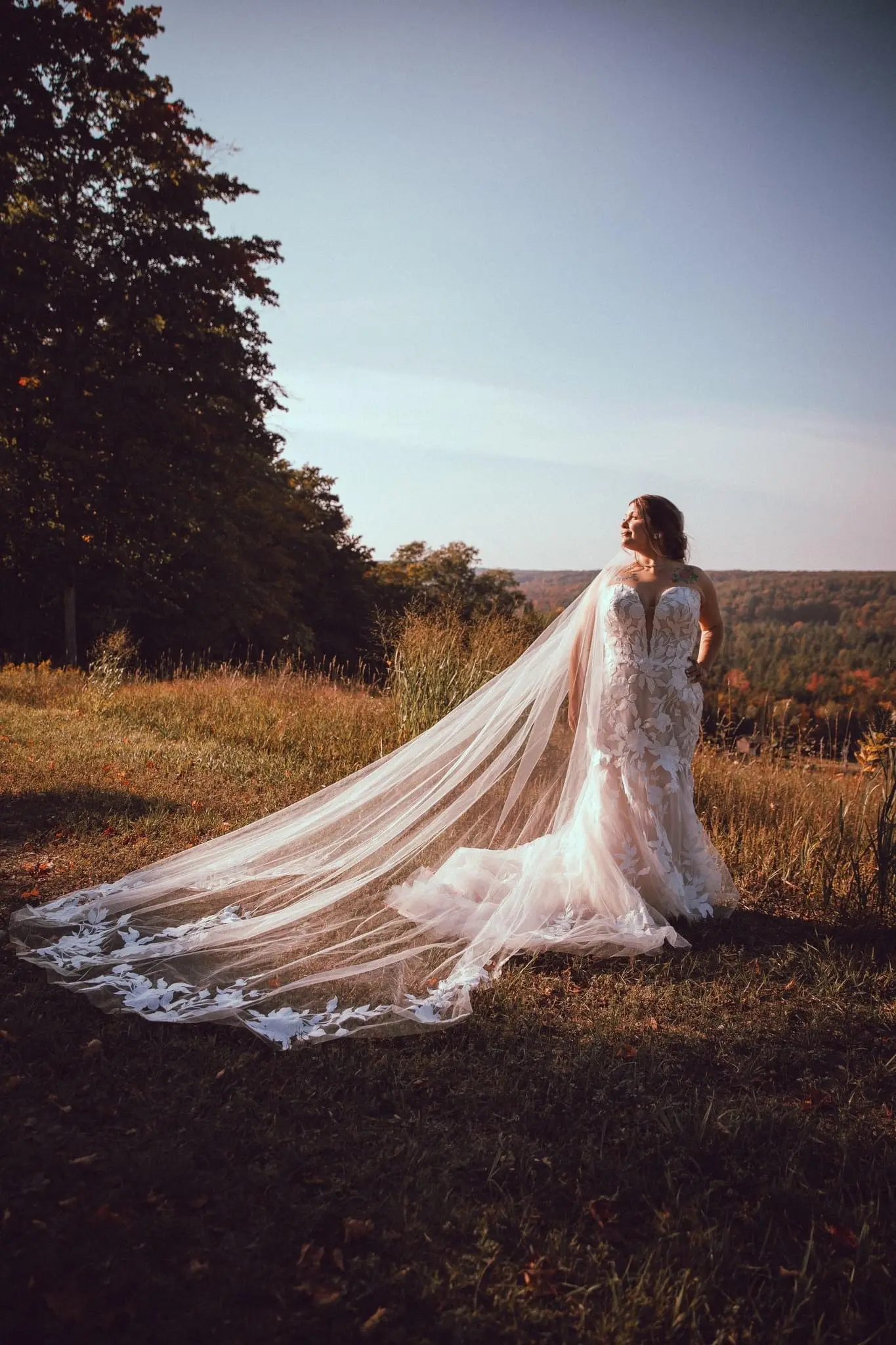 Bride Wearing Lace Fit and Flare Wedding Dress Called Hattie By Rebecca Ingram
