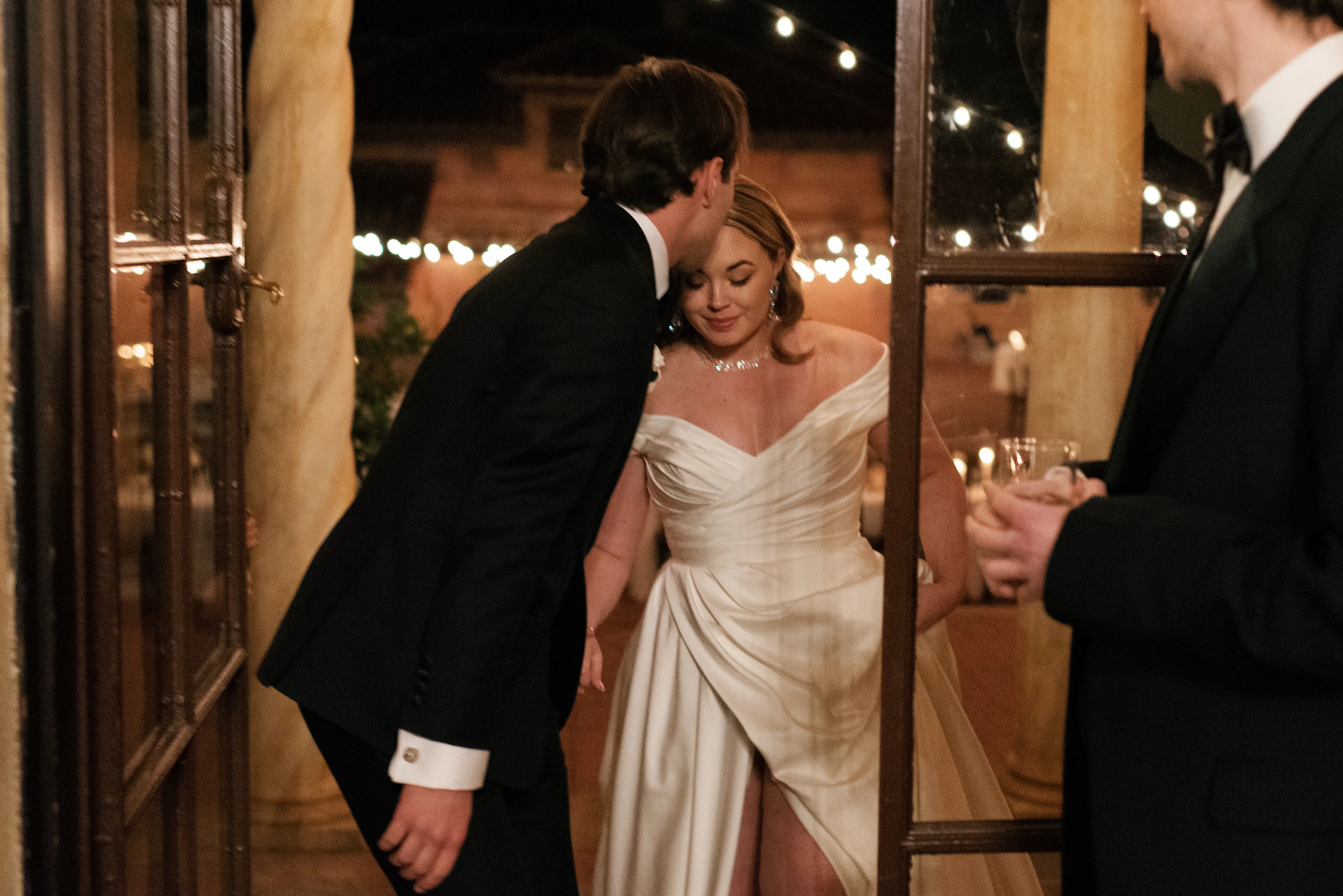 Bride wearing Ekaterina by Maggie Sottero being kissed by her husband