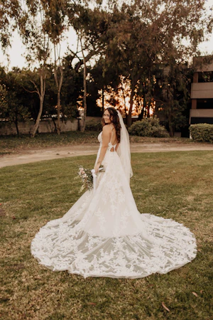 Bride wearing wedding dress called Marlow with keyhole back.