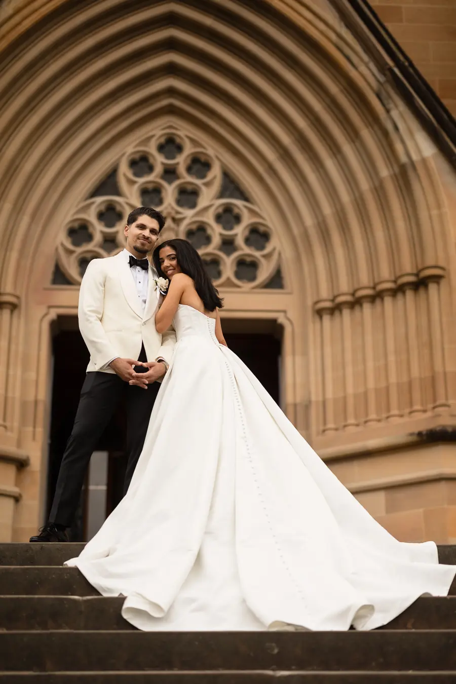 Bride wearing Derrick by Maggie Sottero with her husband