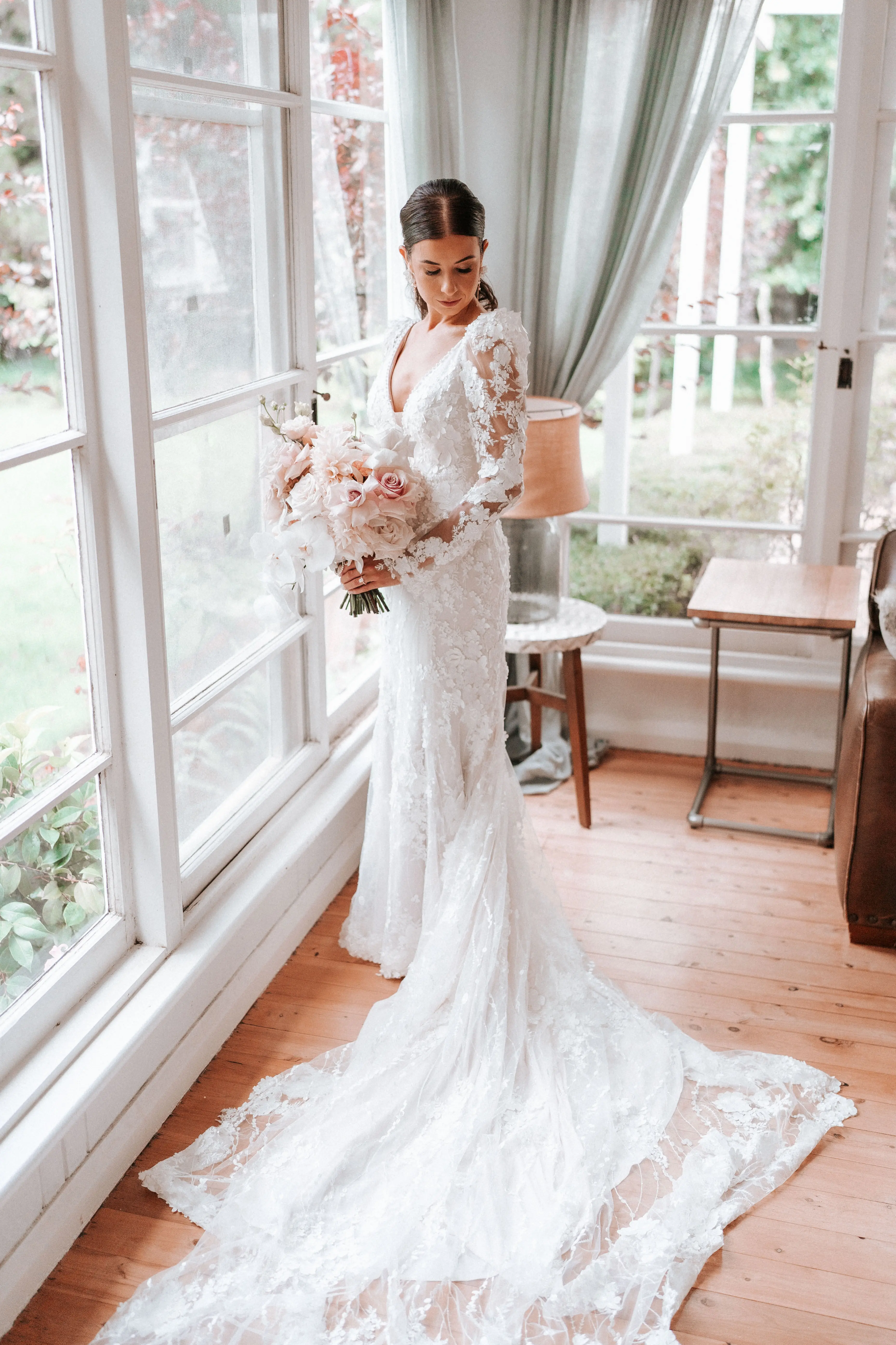 Real Bride wearing puff sleeve wedding dress with 3D floral details called Cruz by Sottero and Midgley..