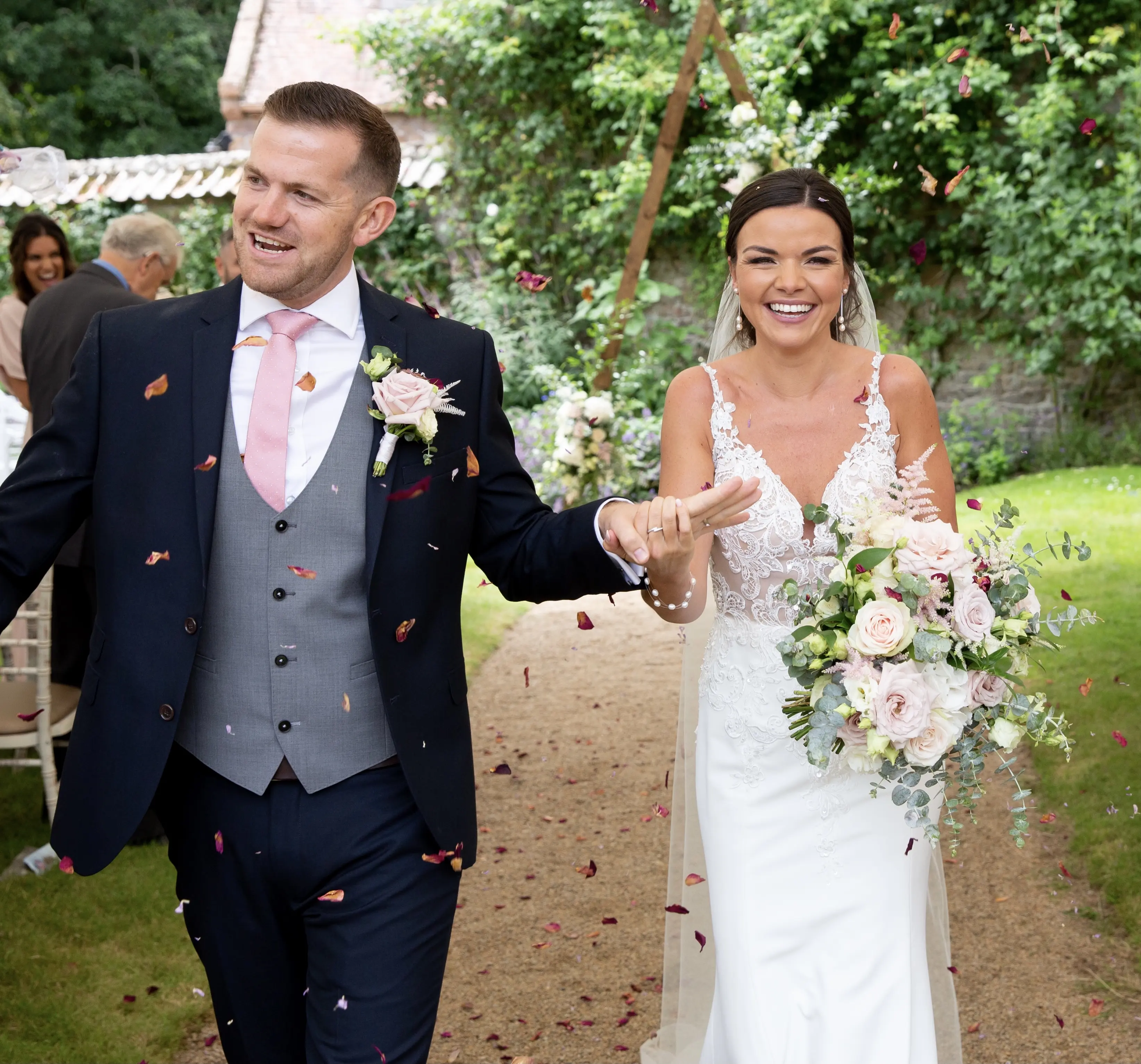 Bride with groom wearing crepe sheath wedding dress