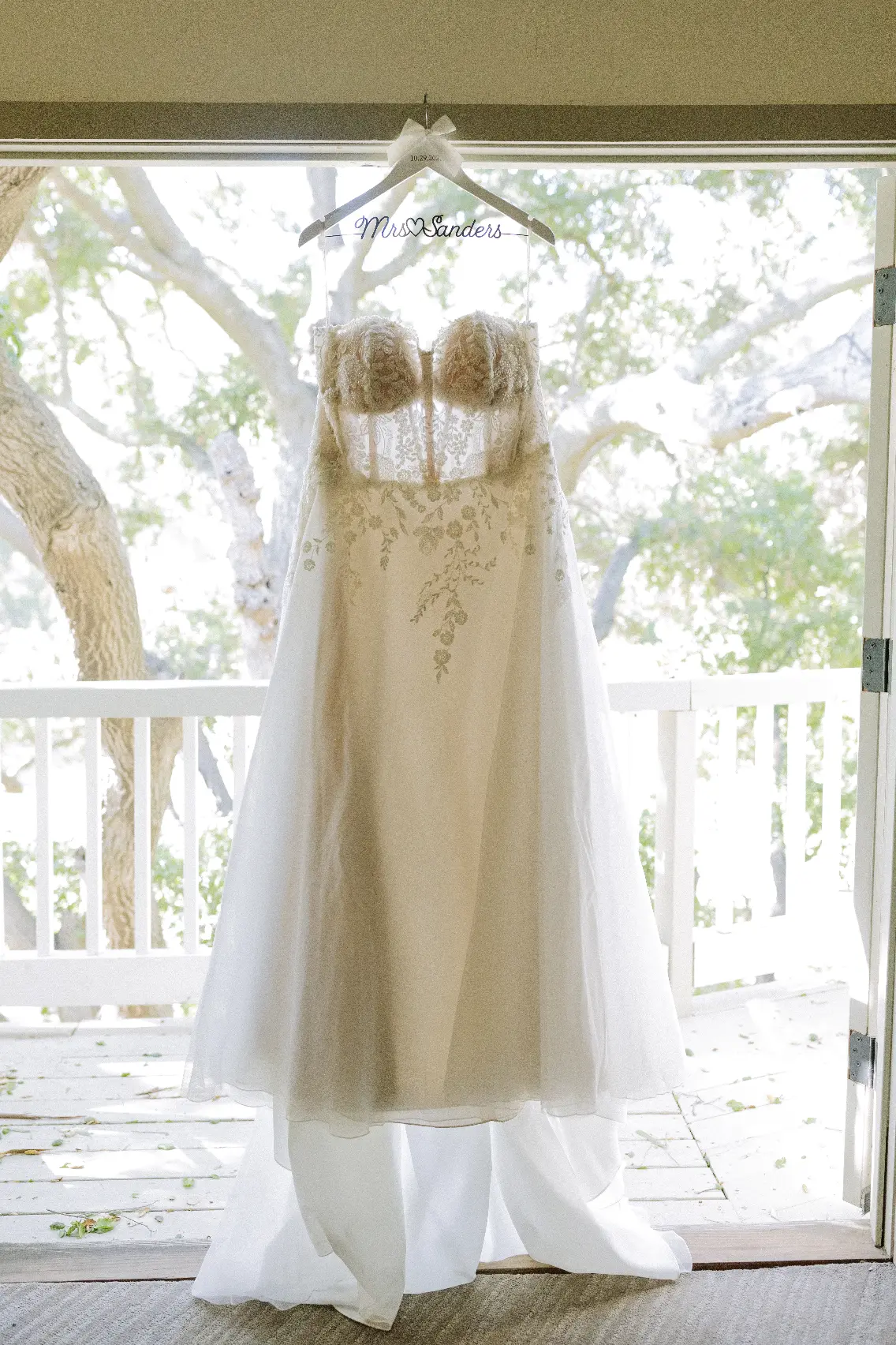 A-line Bridal Dress Ainsleigh By Rebecca Ingram Hanging From A Window