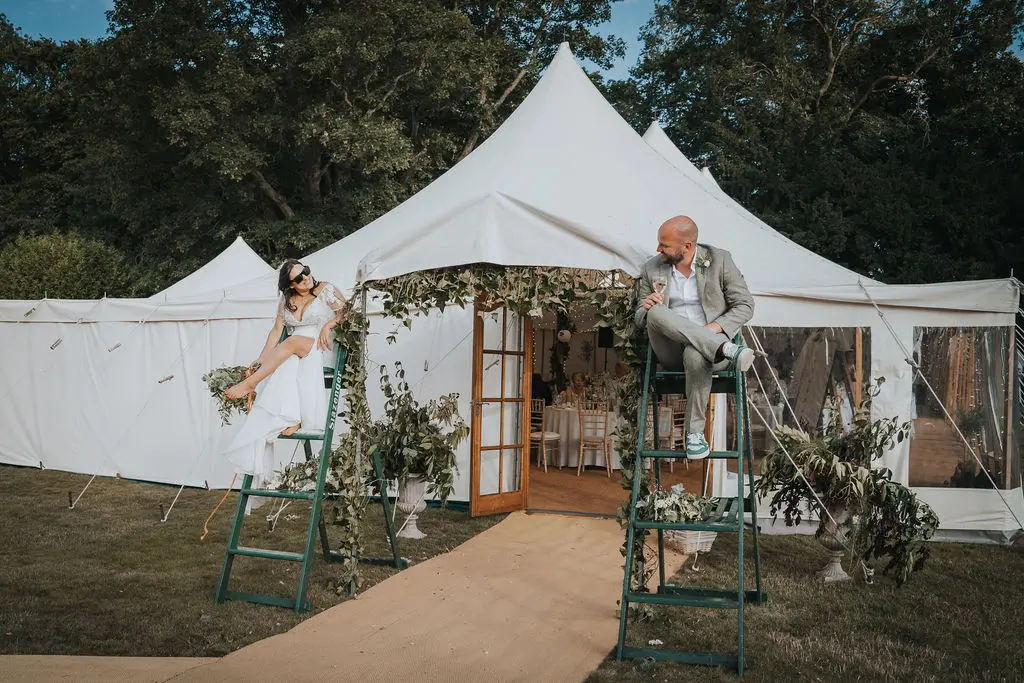 Bride wearing Lorraine by Rebecca Ingram sitting by her husband
