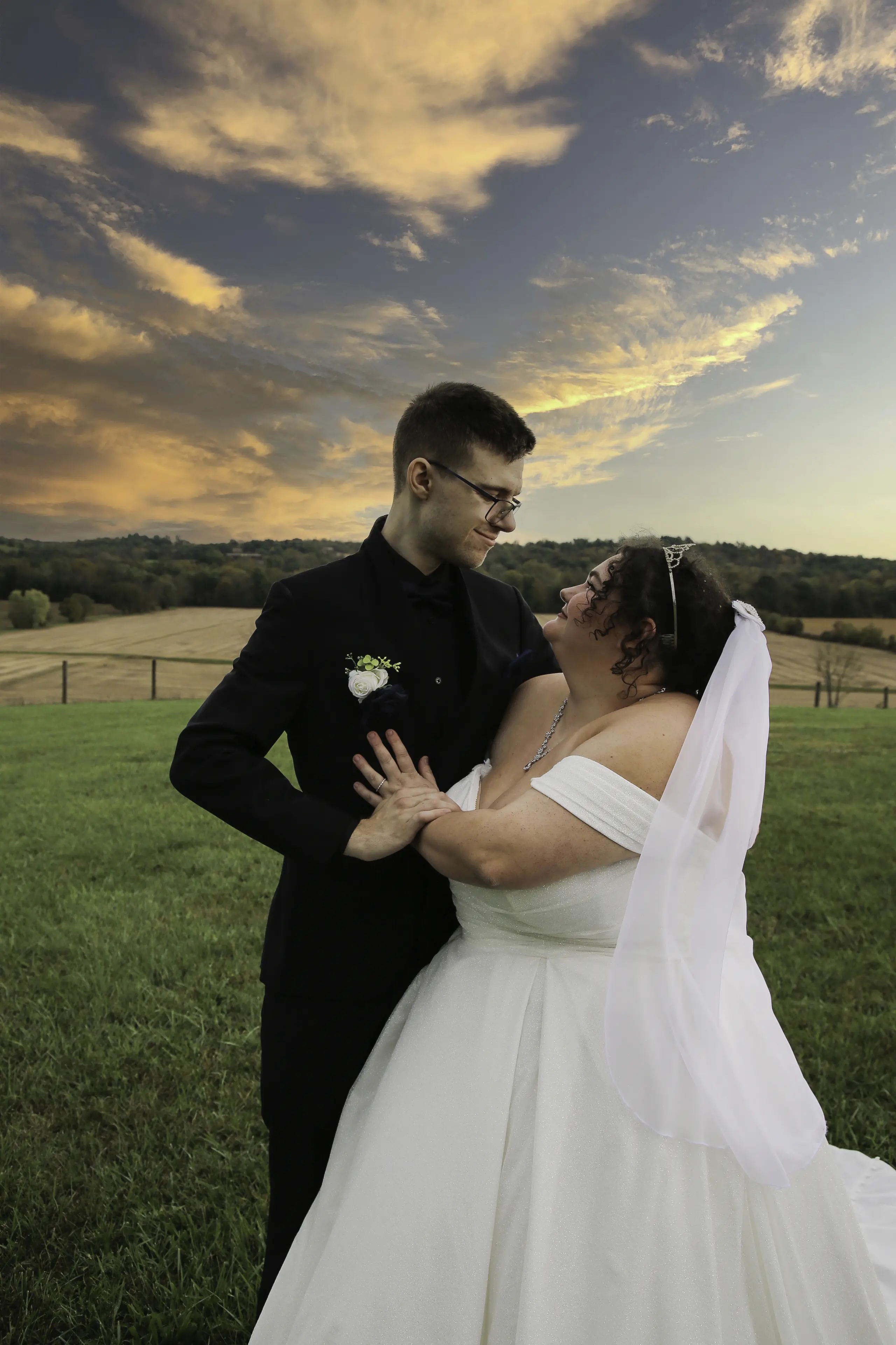 Bride wearing Anniston by Maggie Sottero smiling at her husband
