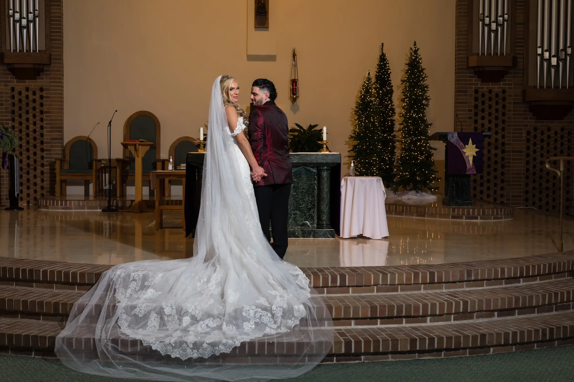 Bride In Lace Off The Shoulder Wedding Dresses Called Fiona By Maggie Sottero With Groom