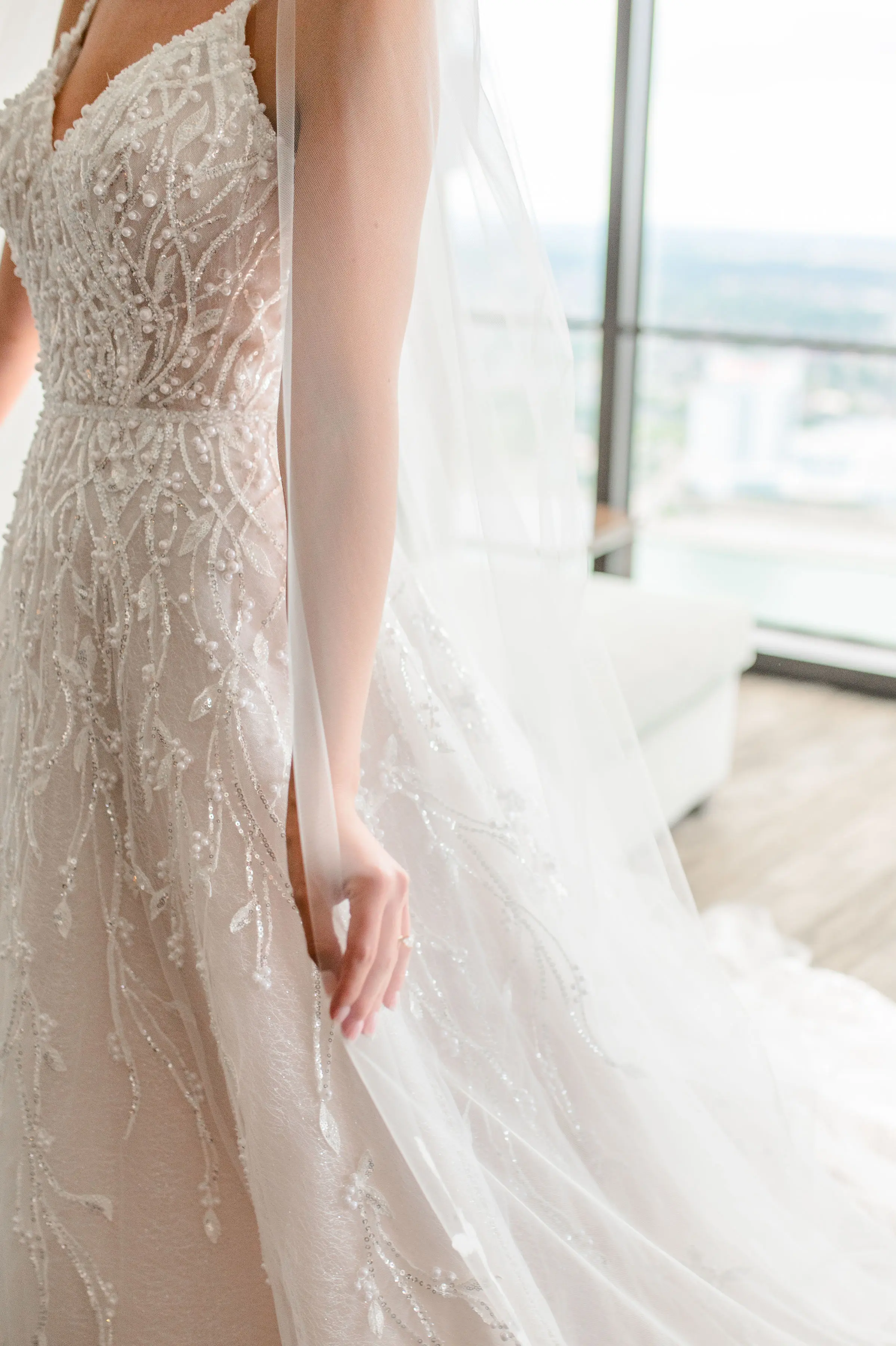 Bride wearing Marvine wedding gown by Sottero and Midgley
