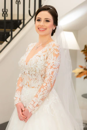 Bride Smiling While Wearing Lace A-Line Wedding Dress Called Zander By Sottero And Midgley