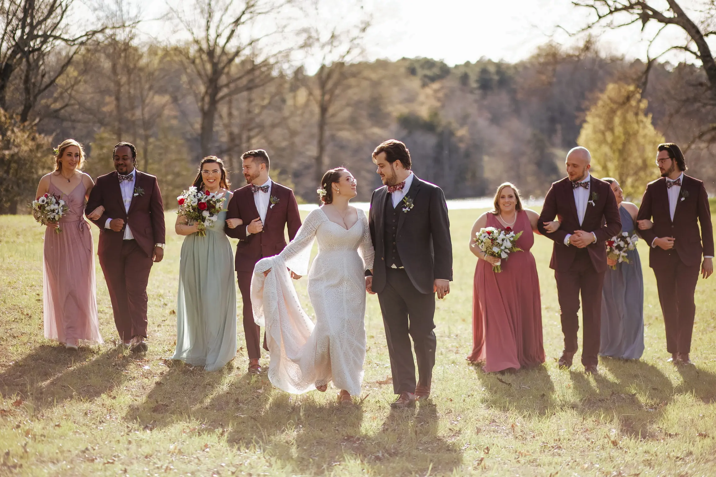Family & Friends with Newlyweds. Bride in Geometric Allover Lace Wedding Dress with Sweetheart Neckline Called Dover by Maggie Sottero