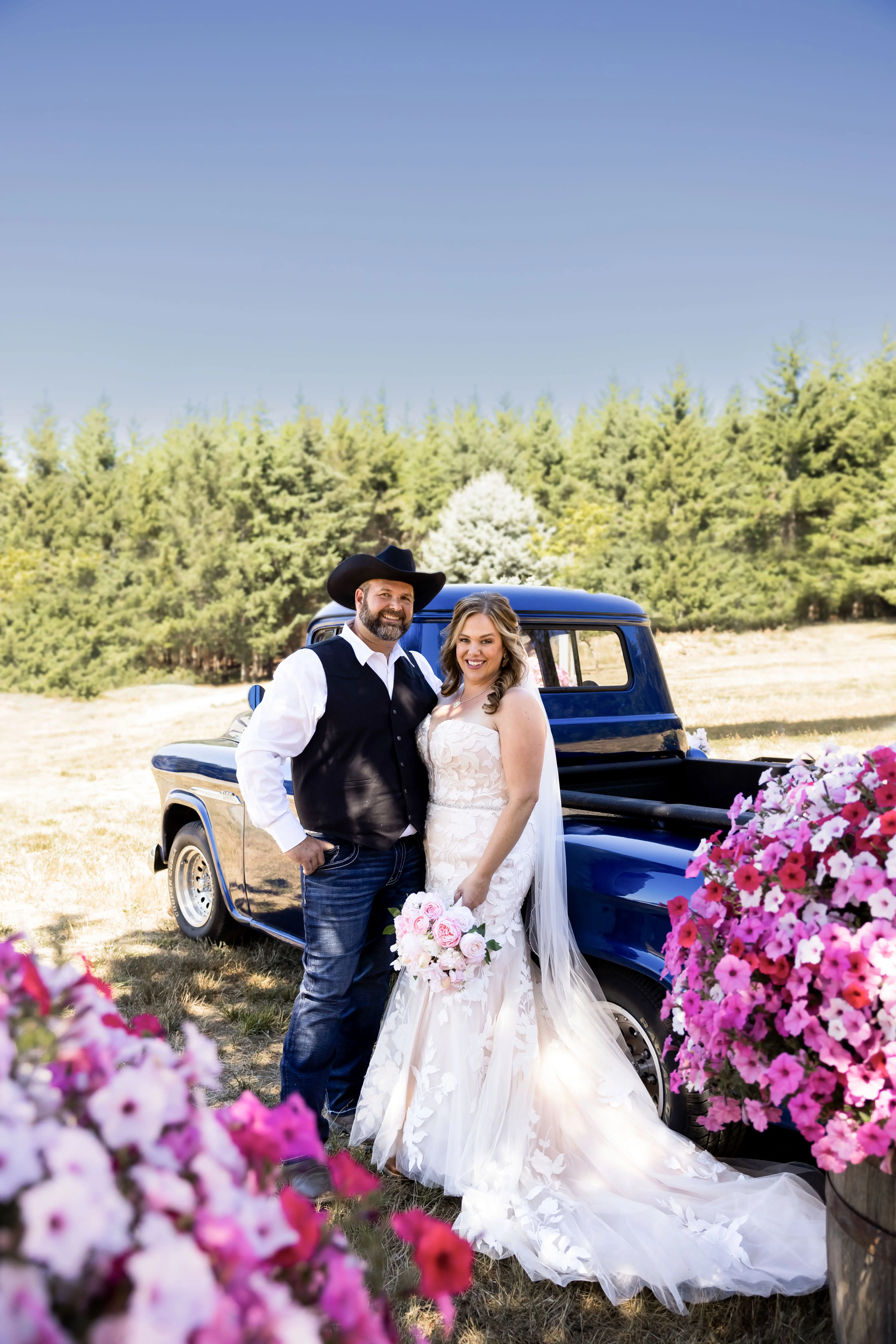 Bride wearing Hattie wedding dress by Rebecca Ingram standing with her husband
