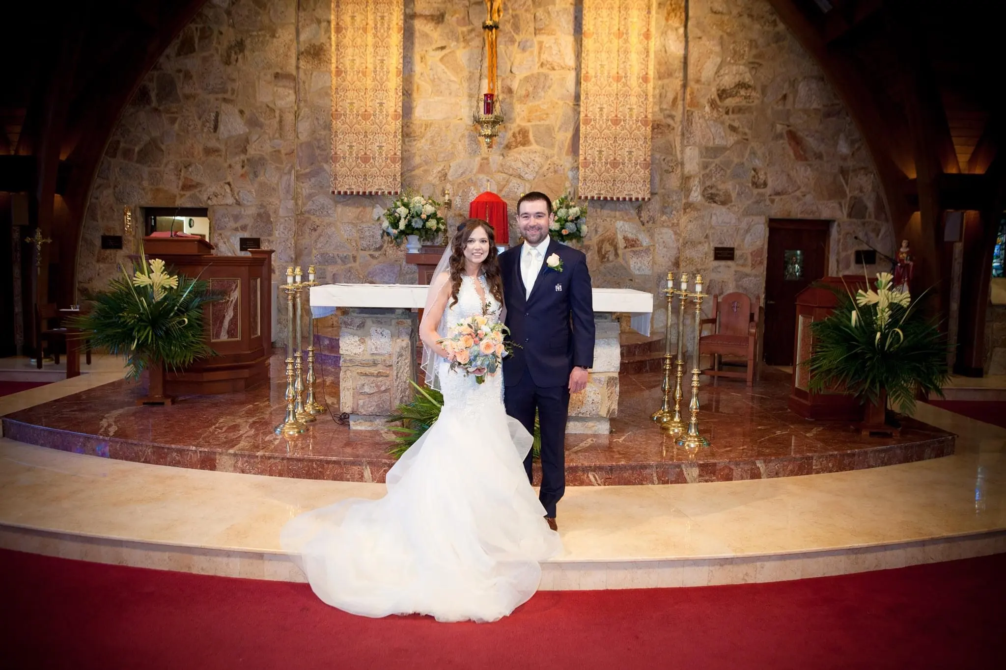Bride with groom wearing organza mermaid wedding dress