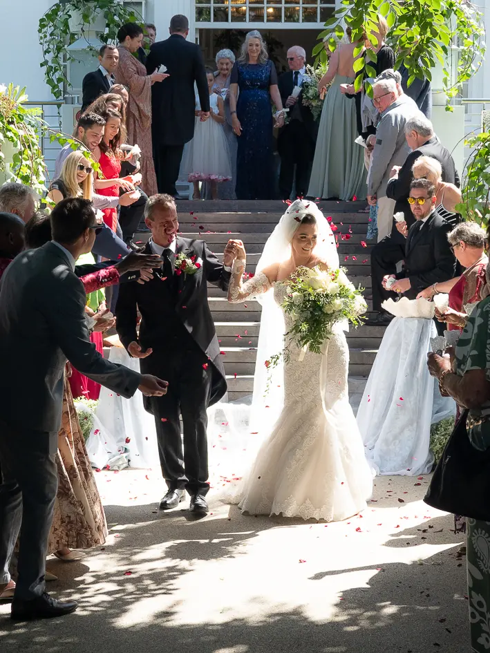 Bride In Lace Fit And Flare Wedding Dress Called Fiona By Maggie Sottero During Wedding Exit