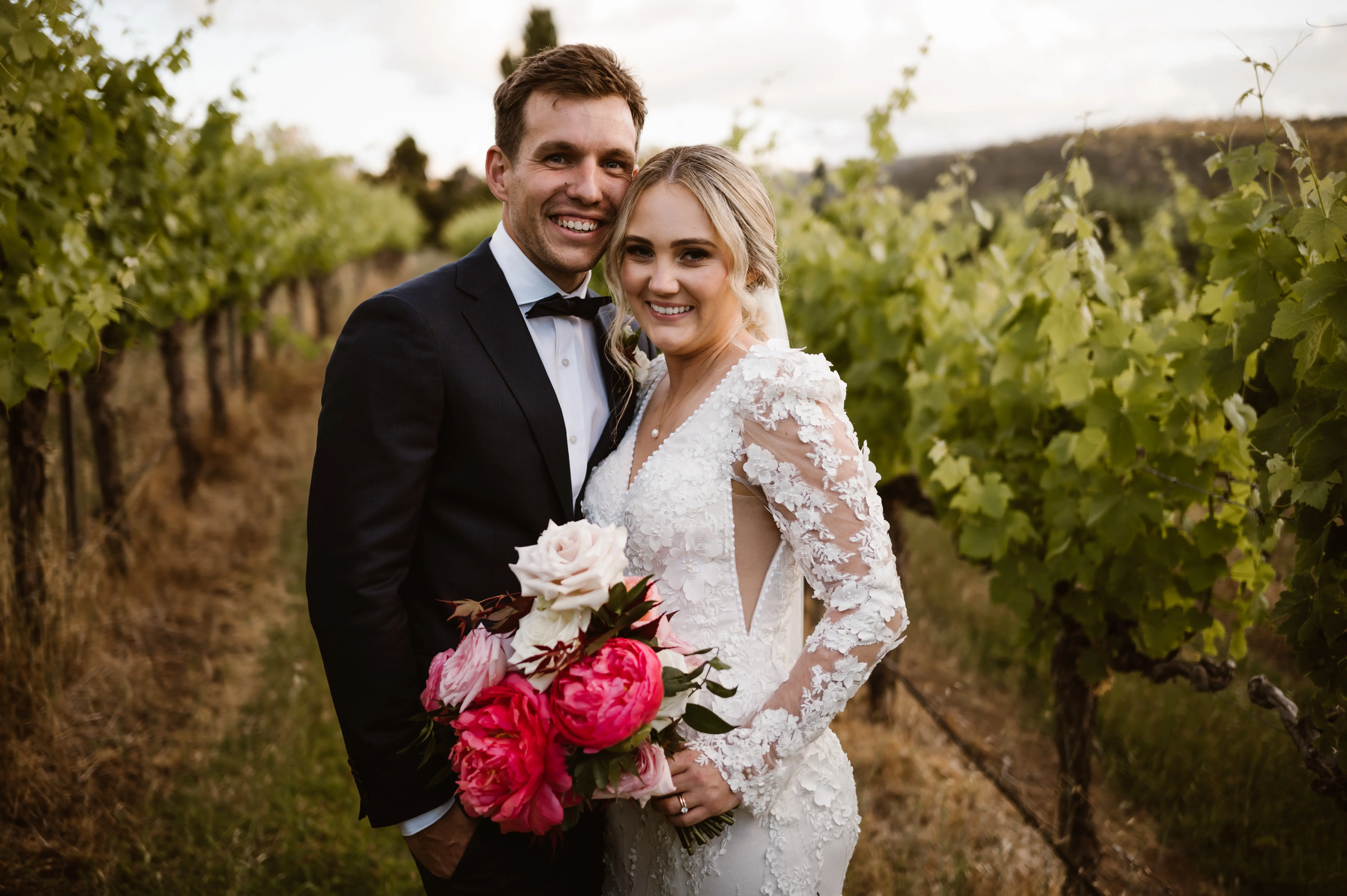 Groom with Bride in Vintage Inspired Puff Sleeve Mermaid Wedding Dress in 3-D Floral Motifs Called Cruz by Sottero & Midgley