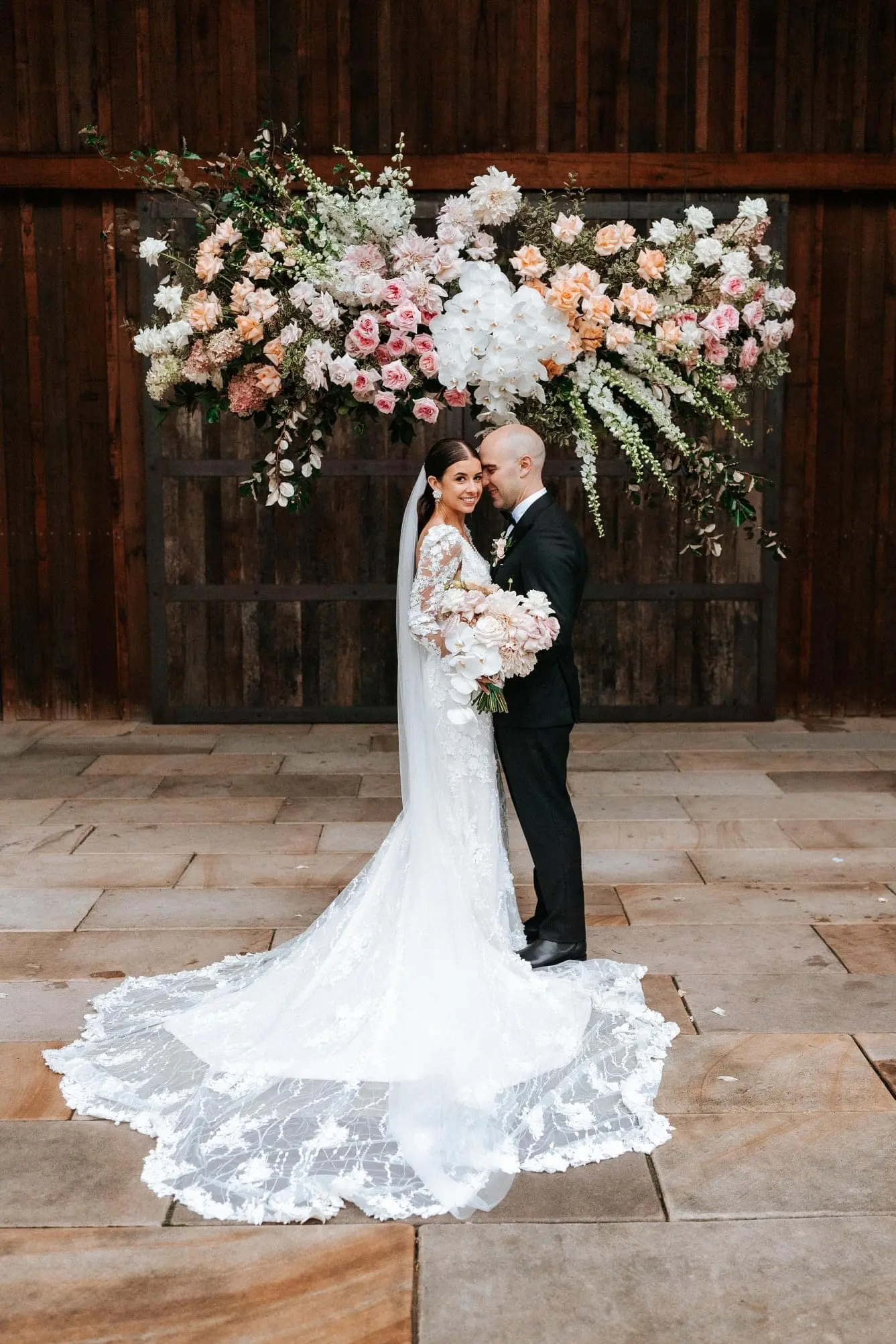 Real Bride wearing puff sleeve wedding dress with 3D floral details called Cruz by Sottero and Midgley..