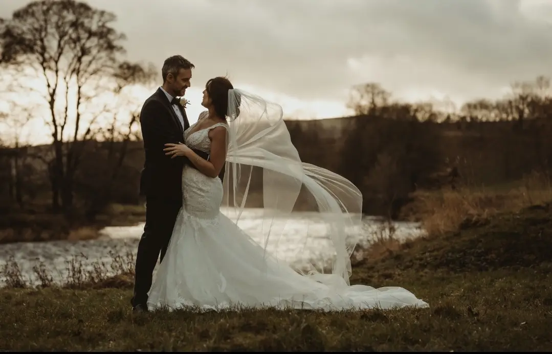 Real Bride in V-Neckline Mermaid Wedding Dress Named Joss by Sottero & Midgley with Groom