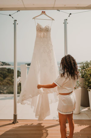 Bride holding lace A-line wedding dress