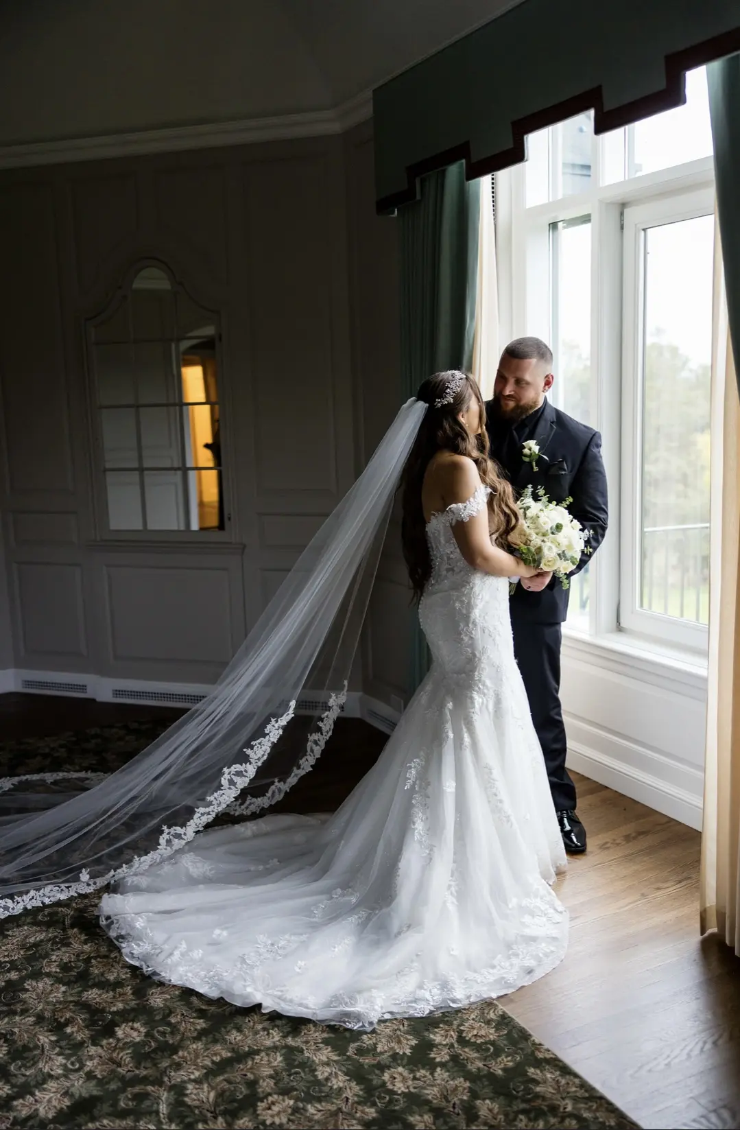 Bride wearing Lennon wedding dress by Maggie Sottero with her husband