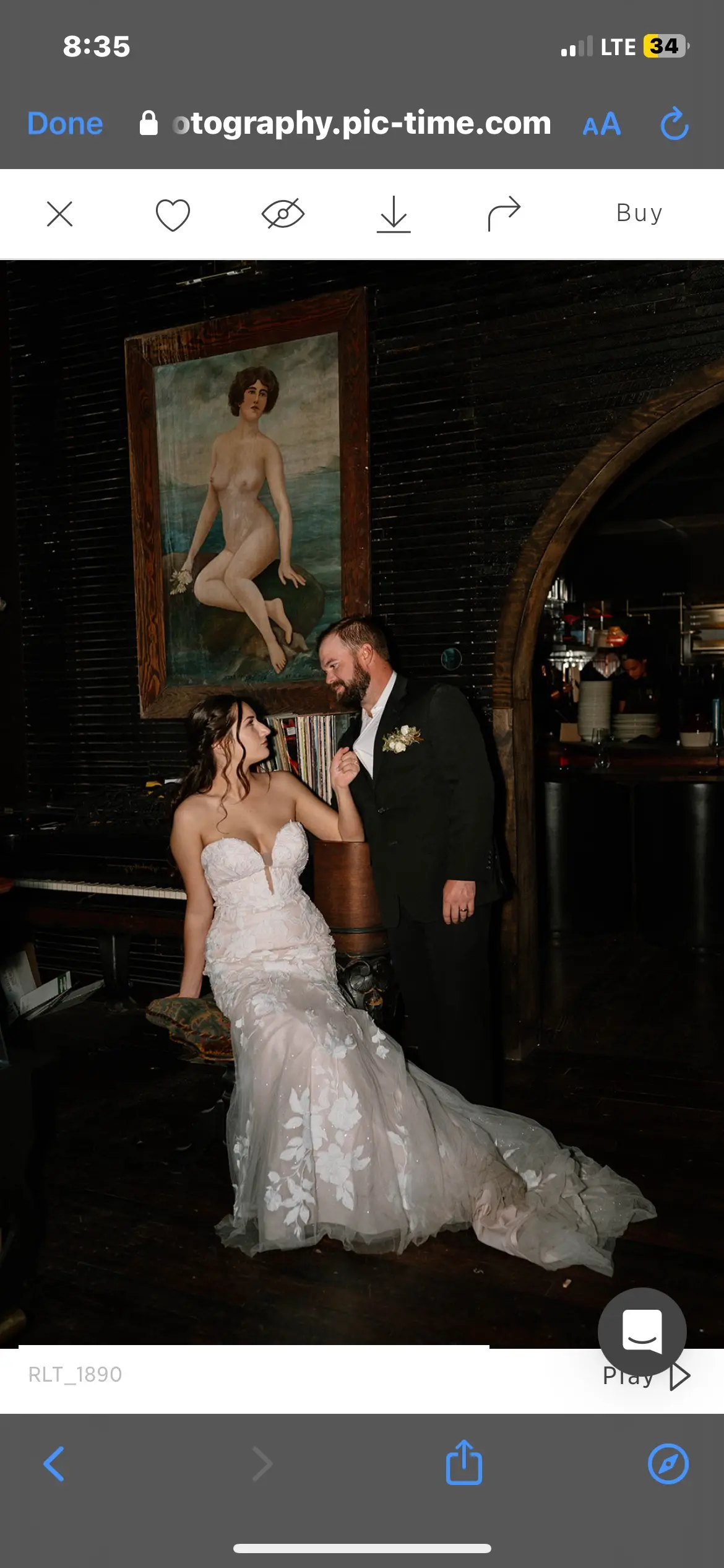 Bride wearing Hattie wedding dress by Rebecca Ingram sitting with her husband