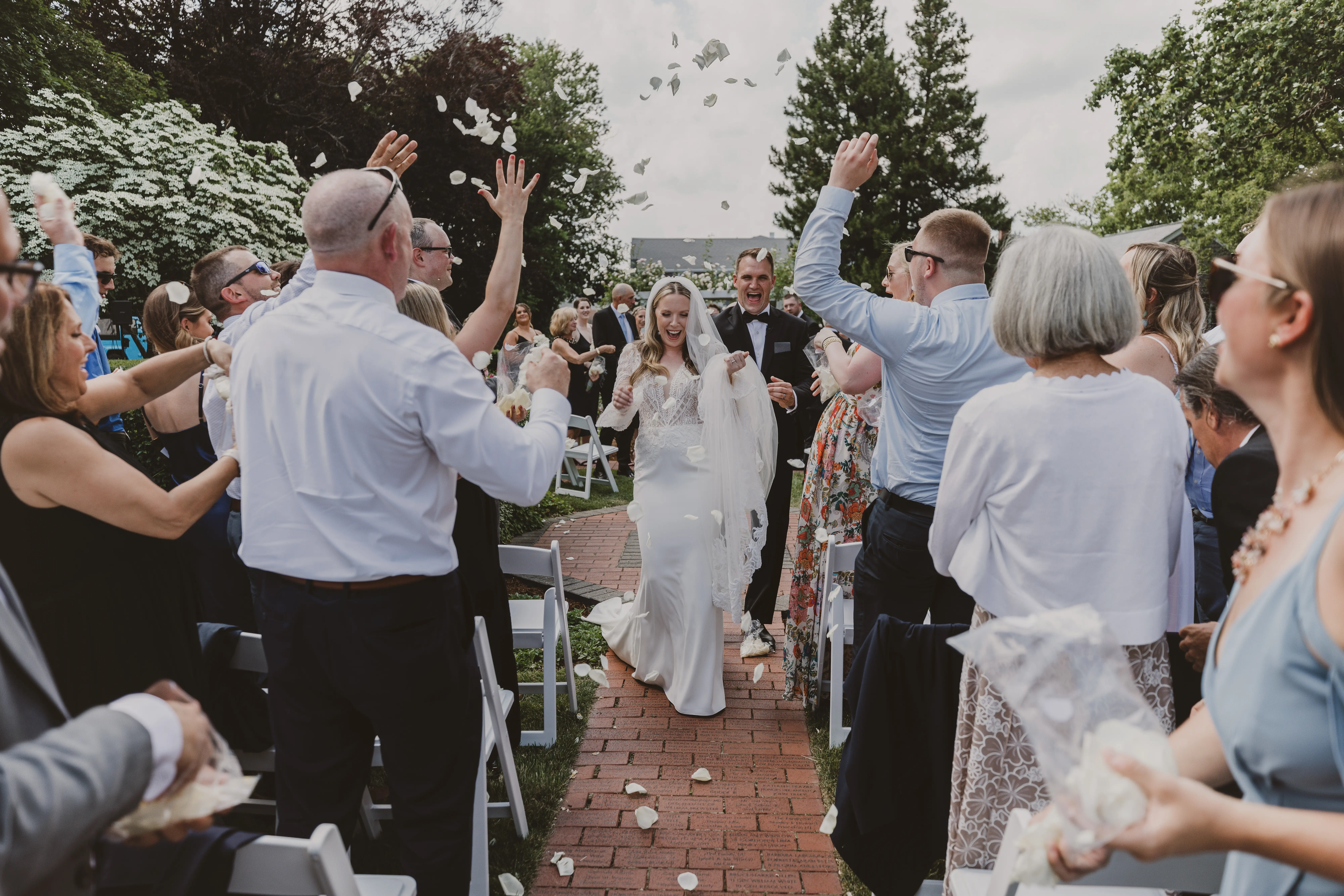 Confetti throw and cheering as the couple are now wed.