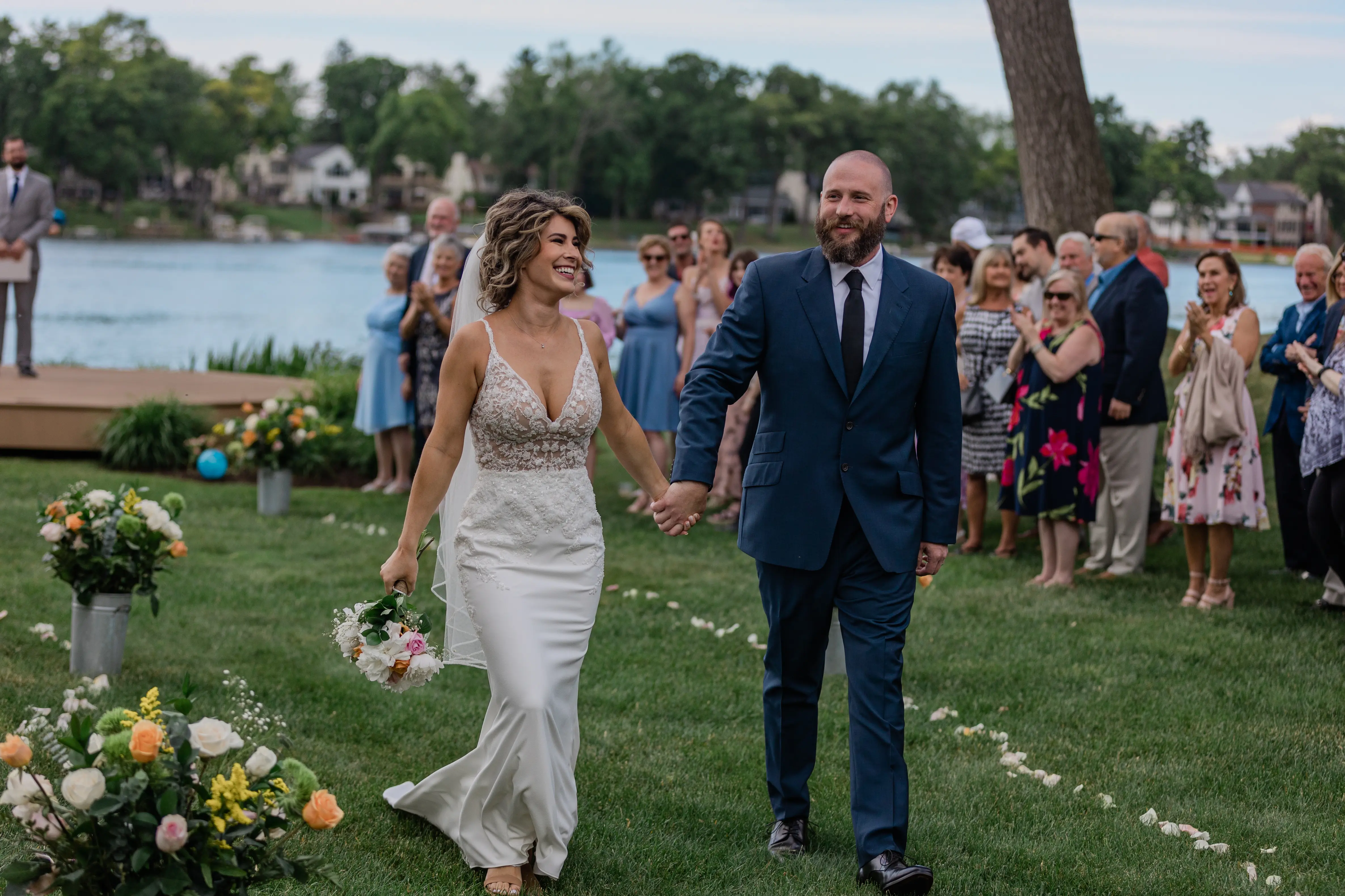 Groom With Bride Wearing V-Neck Sheath Wedding Dress Carmen By Rebecca Ingram