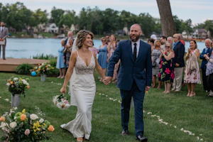 Groom With Bride Wearing V-Neck Sheath Wedding Dress Carmen By Rebecca Ingram