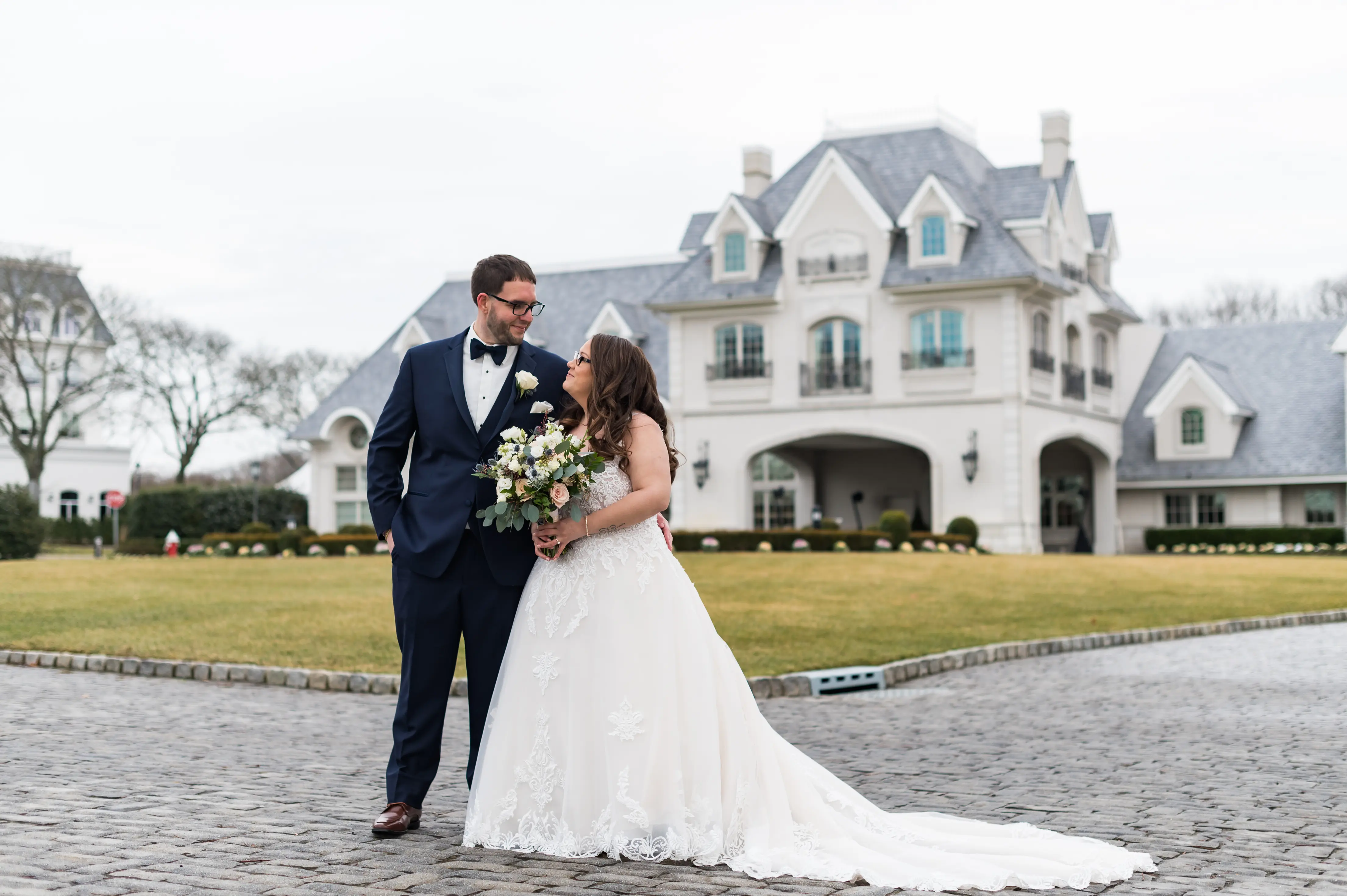 Bride in V neck ballgown called Trinity Lynette by Maggie Sottero with grrom
