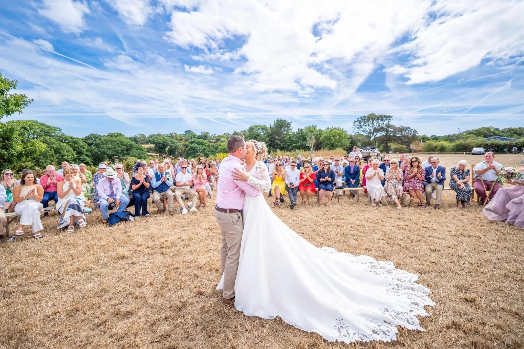 Bride In A-Line Wedding Dress Named Savannah By Maggie Sottero Bride Kissing Groom