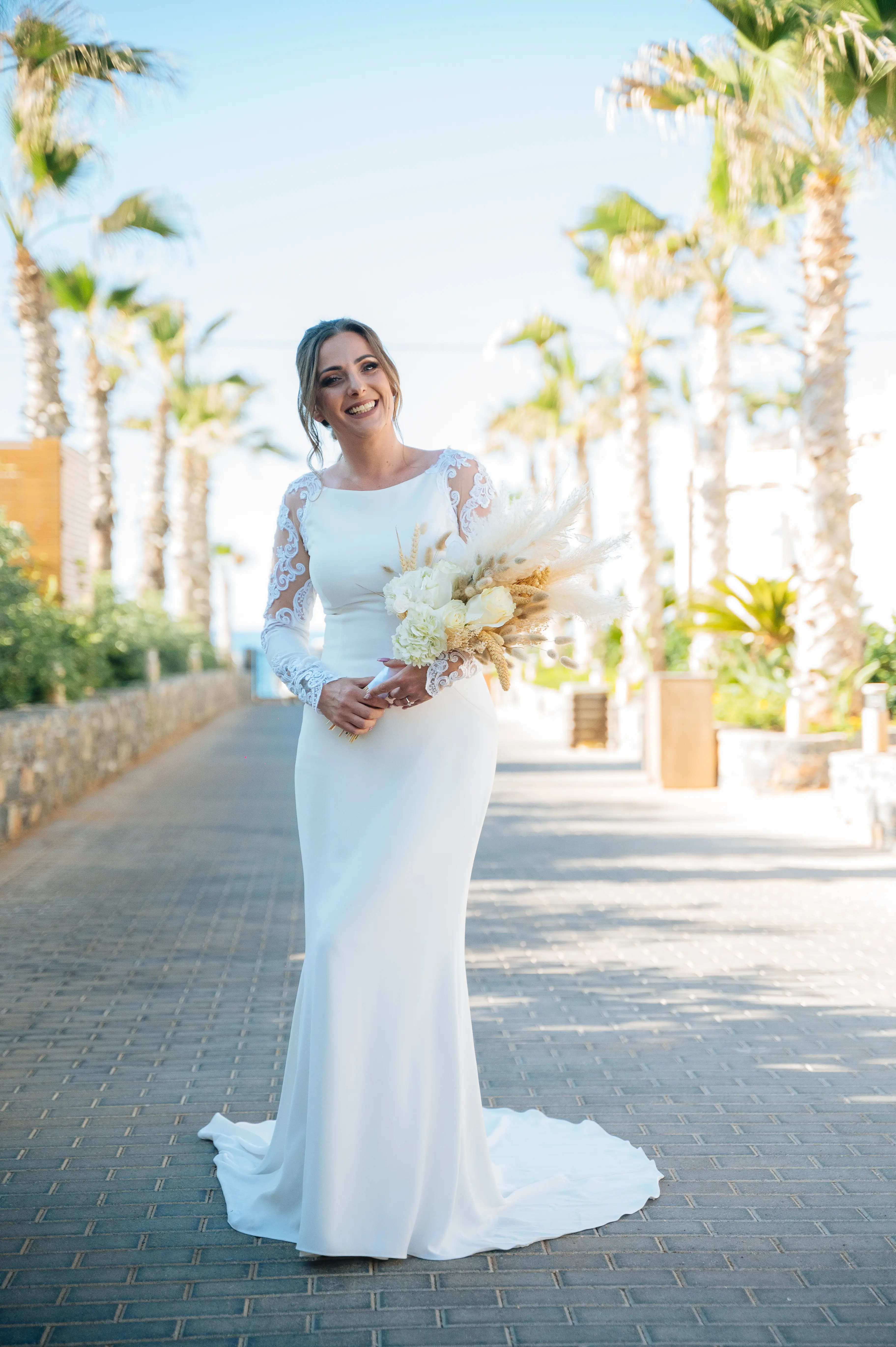 Real Bride in Minimalist Crepe Long Sleeve Lace Sheath Wedding Dress Called Bethany by Rebecca Ingram