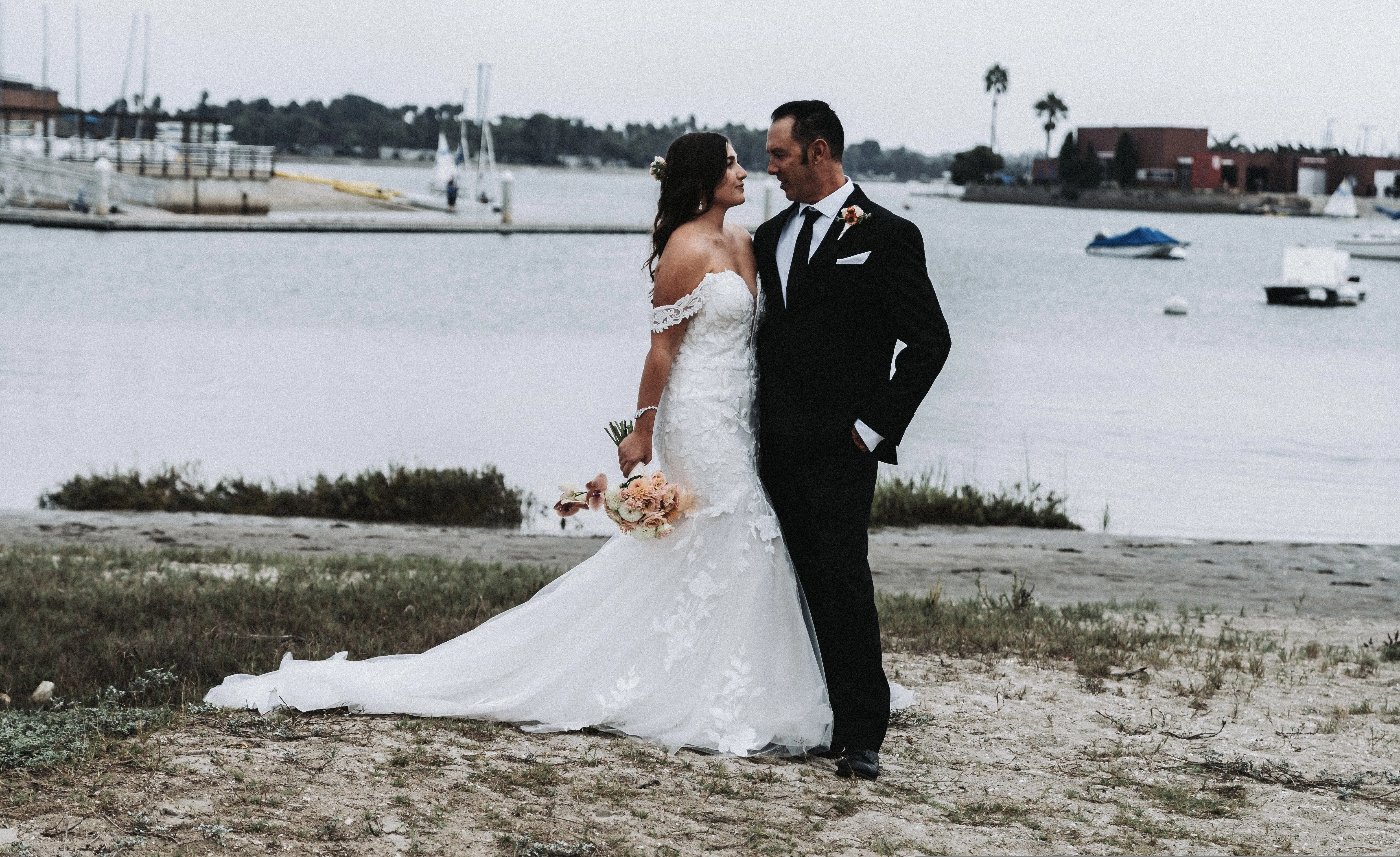 Groom With Bride Wearing Mermaid Wedding Dress With Oversized Lace Hattie By Rebecca Ingram